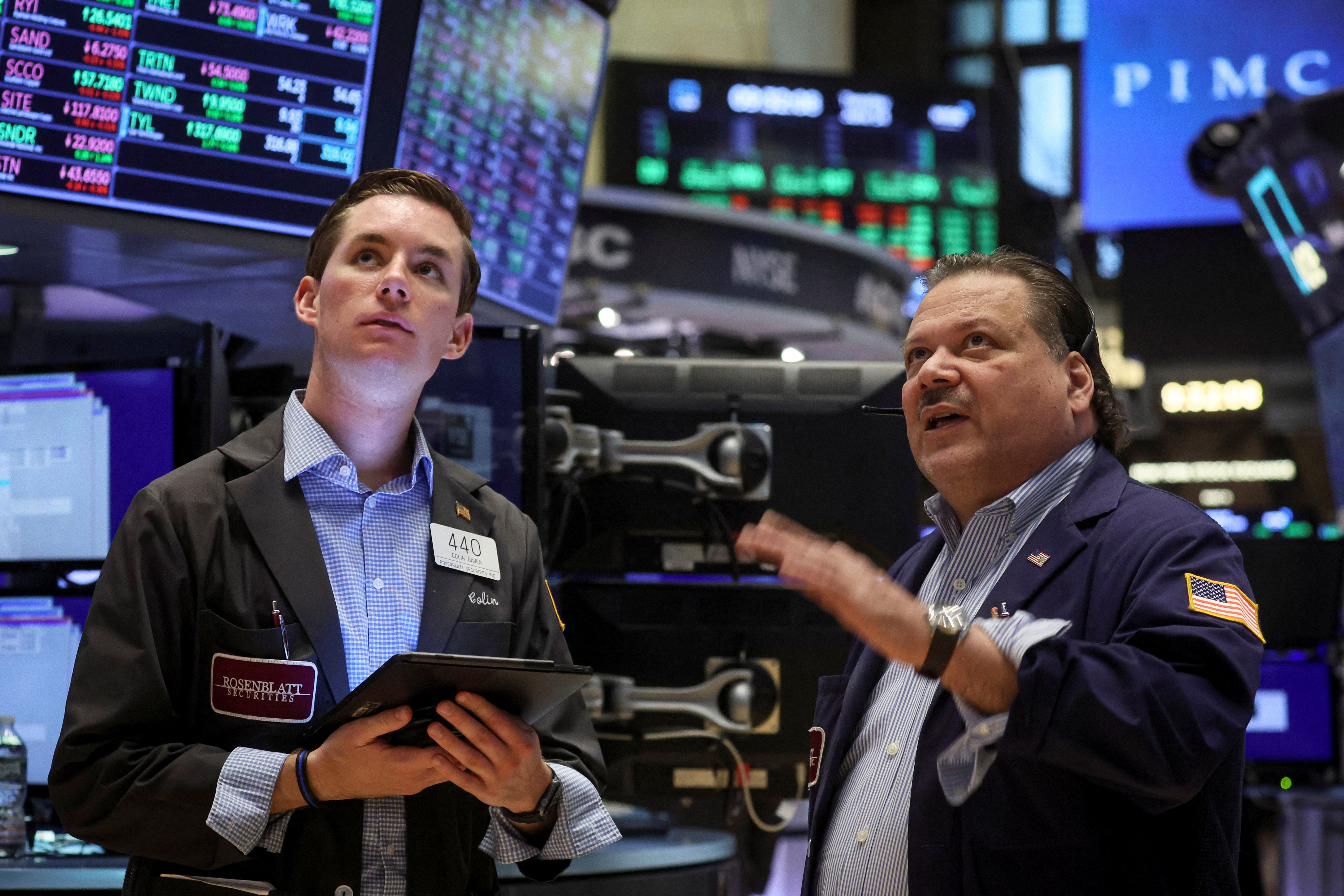 Traders work on the floor of the New York Stock Exchange in New York City, June 14, 2022.
