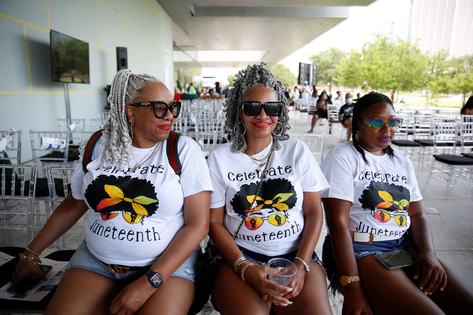 Fatima Walker, her sister Kim Walker and Lauren Ellis celebrate Juneteenth at the Tampa Museum of Art in Tampa, Florida on June 19, 2022.