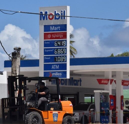 The Mobil gas station in Susupe displays its new prices Thursday morning.