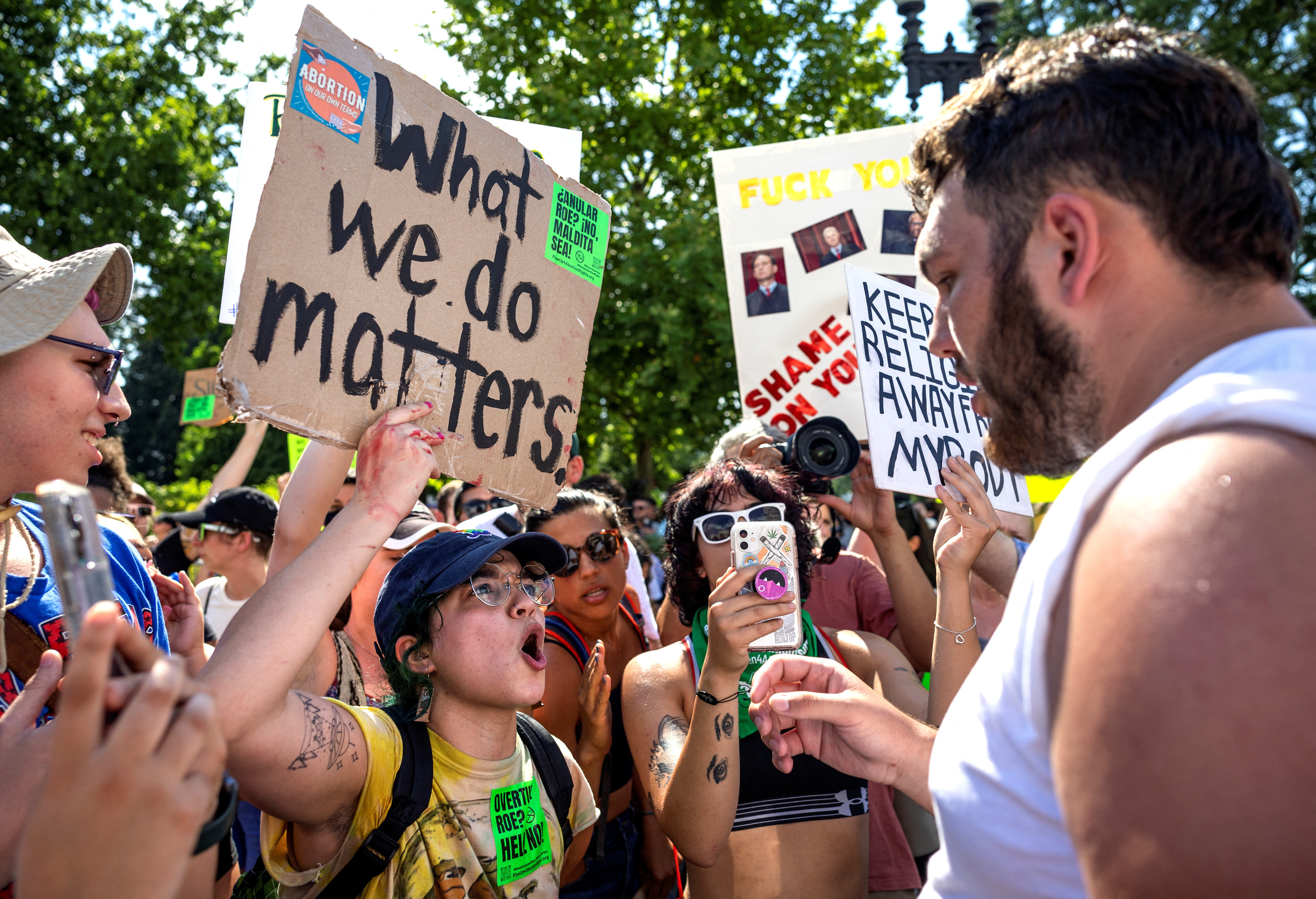 An abortion rights activist argues with one of a handful of anti-abortion protestors near the United States Supreme Court in Washington, D.C., June 25, 2022.