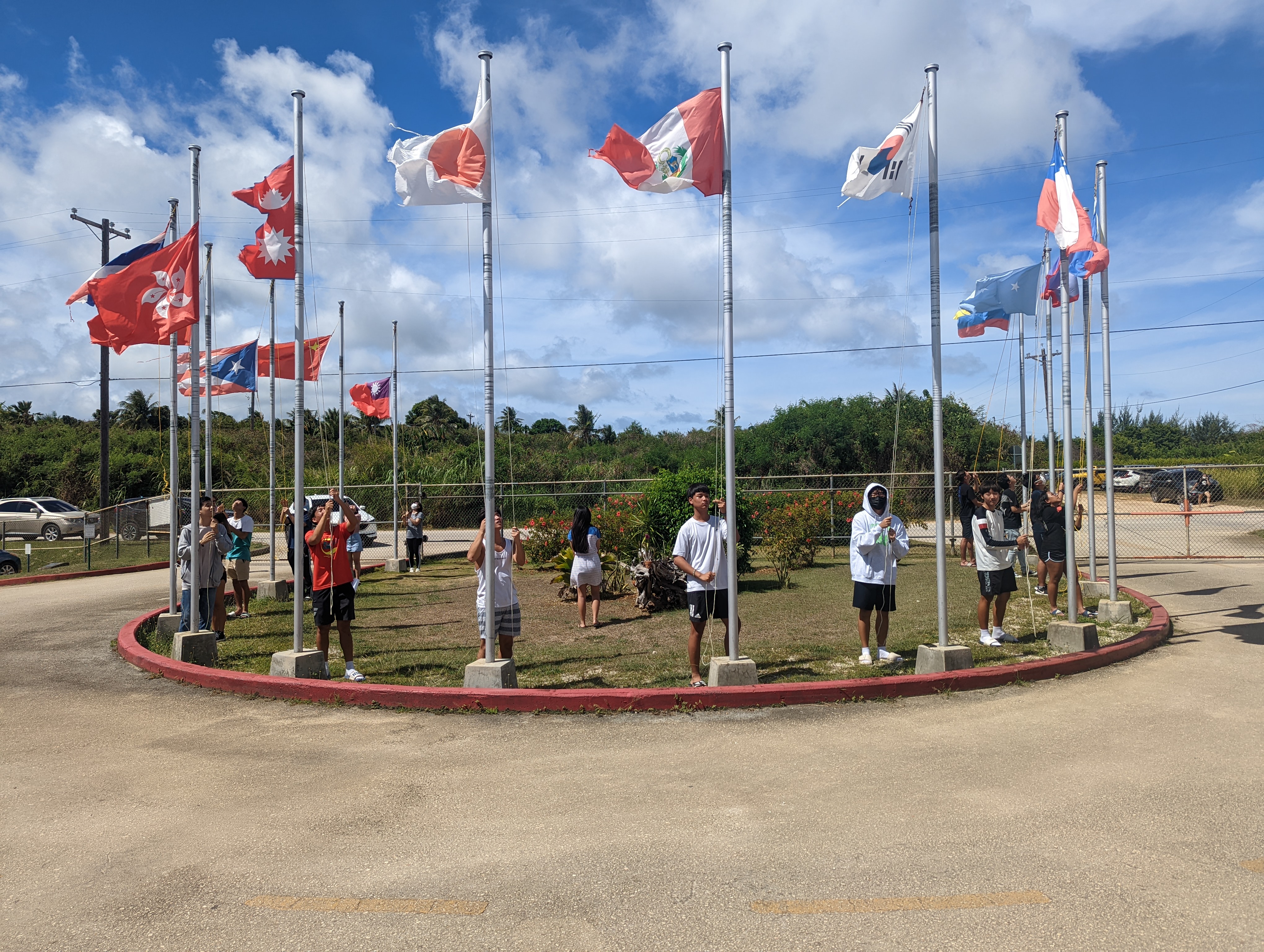 Saipan International School seniors lower all the international flags on their last day of school. The flags stay down until the new school year when the new juniors raise them up again, signifying the start of the new academic year.