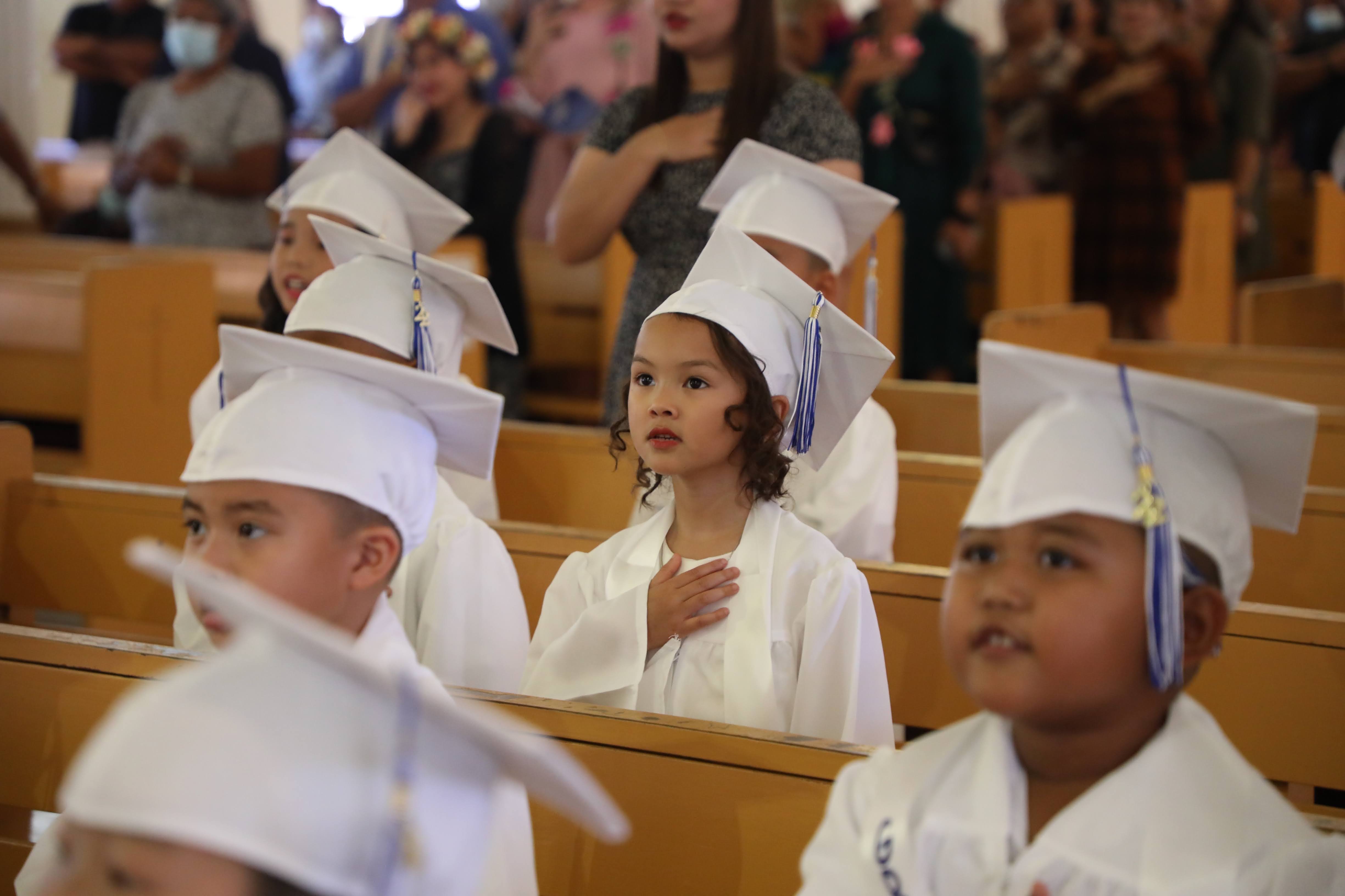 Mount Carmel School’s kindergarten graduates proudly sang the CNMI and national anthems during a traditional promotion ceremony at the Mount Carmel Cathedral.