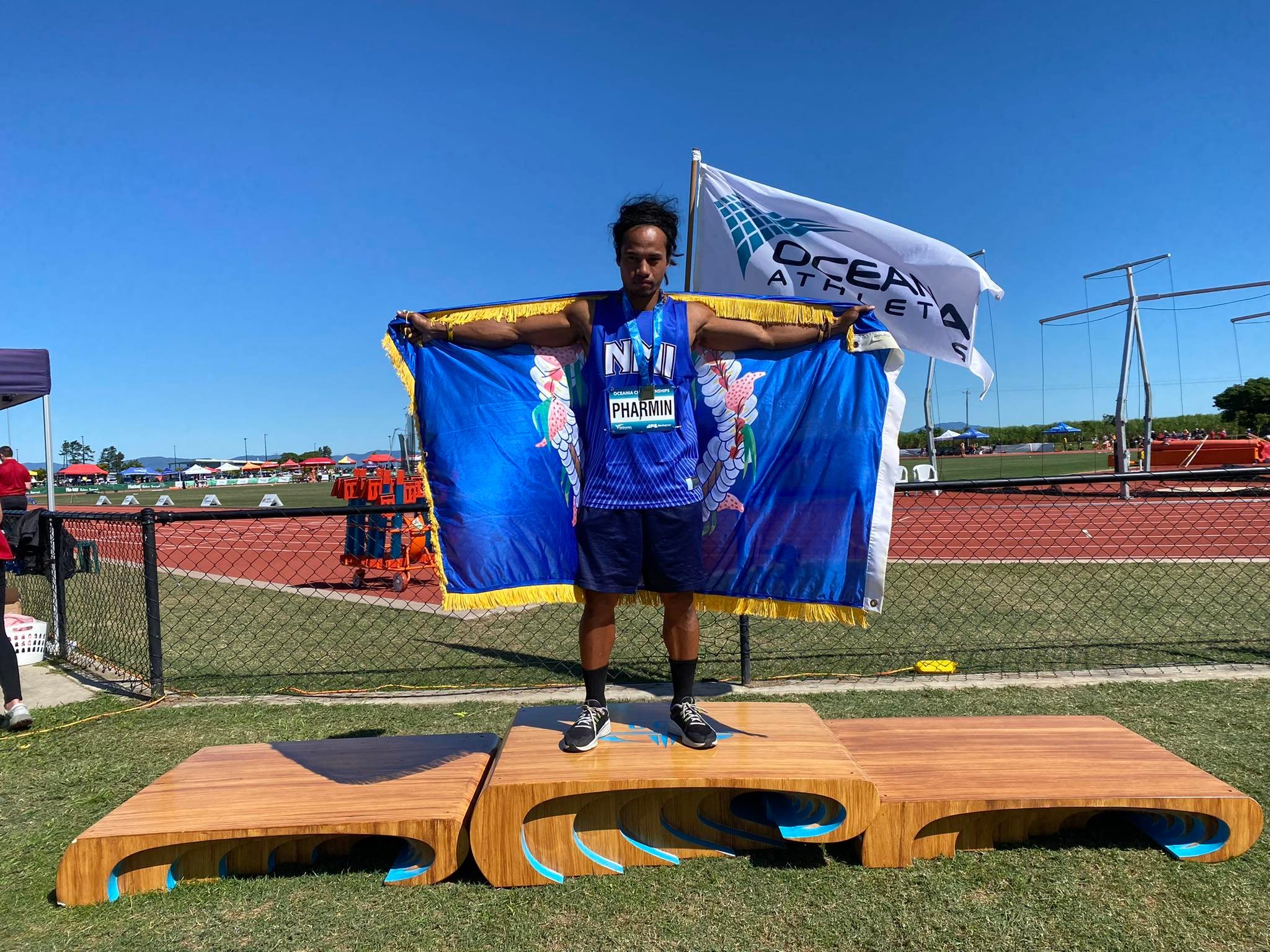 Orrin Pharmin poses with the gold medal he won  Thursday at the 2022 Oceania Athletics Championships in Mackay, Australia.