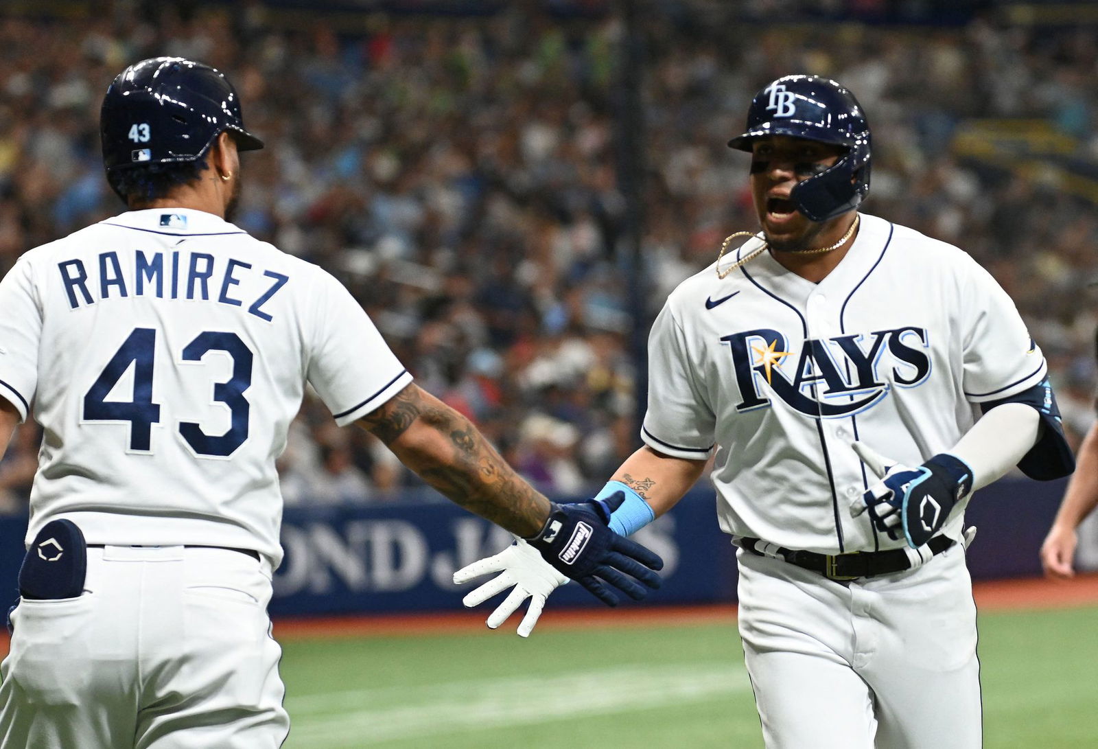 Tampa Bay Rays first baseman Isaac Paredes (17) celebrates with designated hitter Harold Ramirez (43) after hitting a solo home run in the first inning against the New York Yankees at Tropicana Field in St. Petersburg, Florida on June 21, 2022.