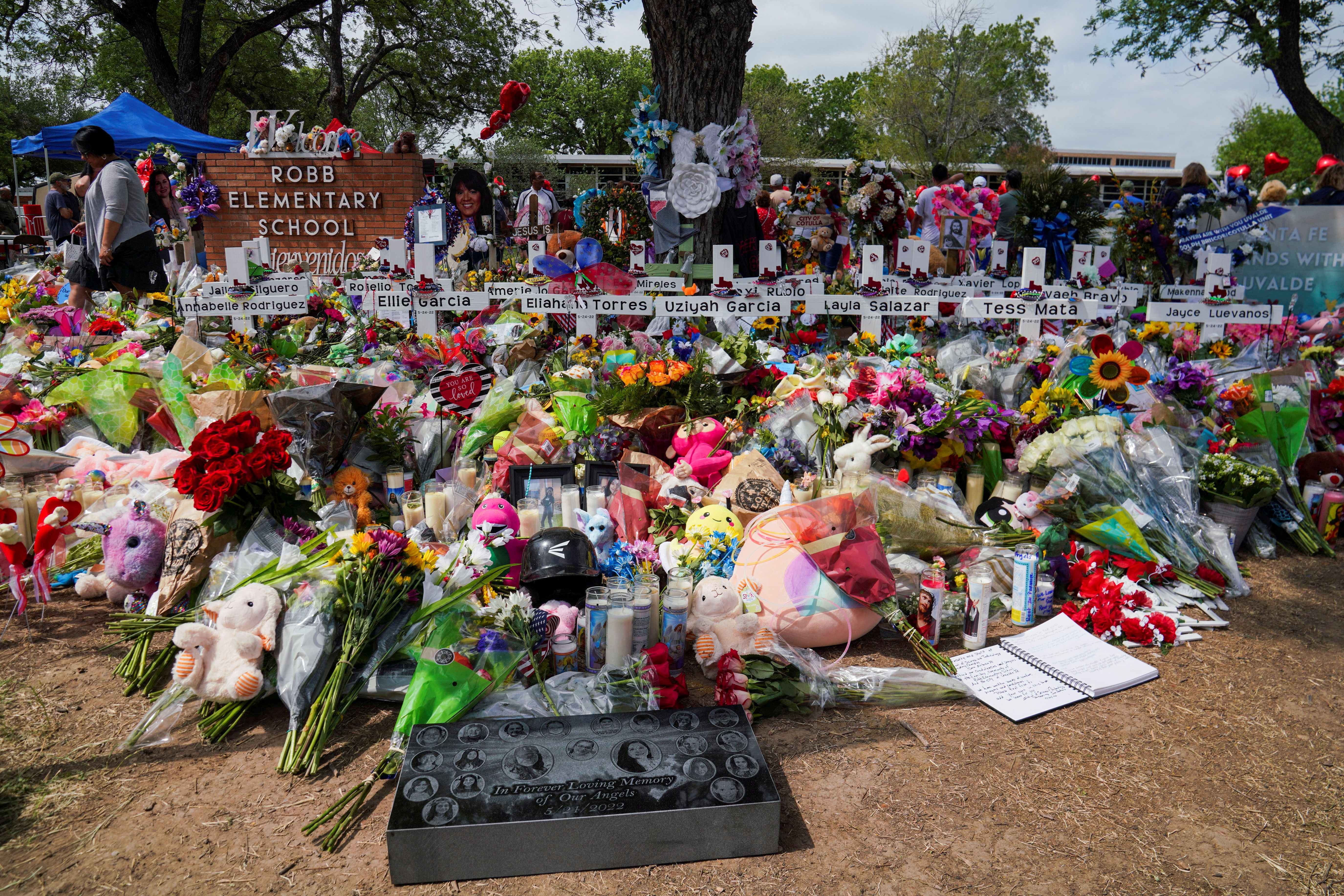 Flowers, toys, and other objects to remember the victims of the deadliest U.S. school mass shooting in nearly a decade, resulting in the death of 19 children and two teachers, are pictured at the Robb Elementary School in Uvalde, Texas, May 30, 2022.