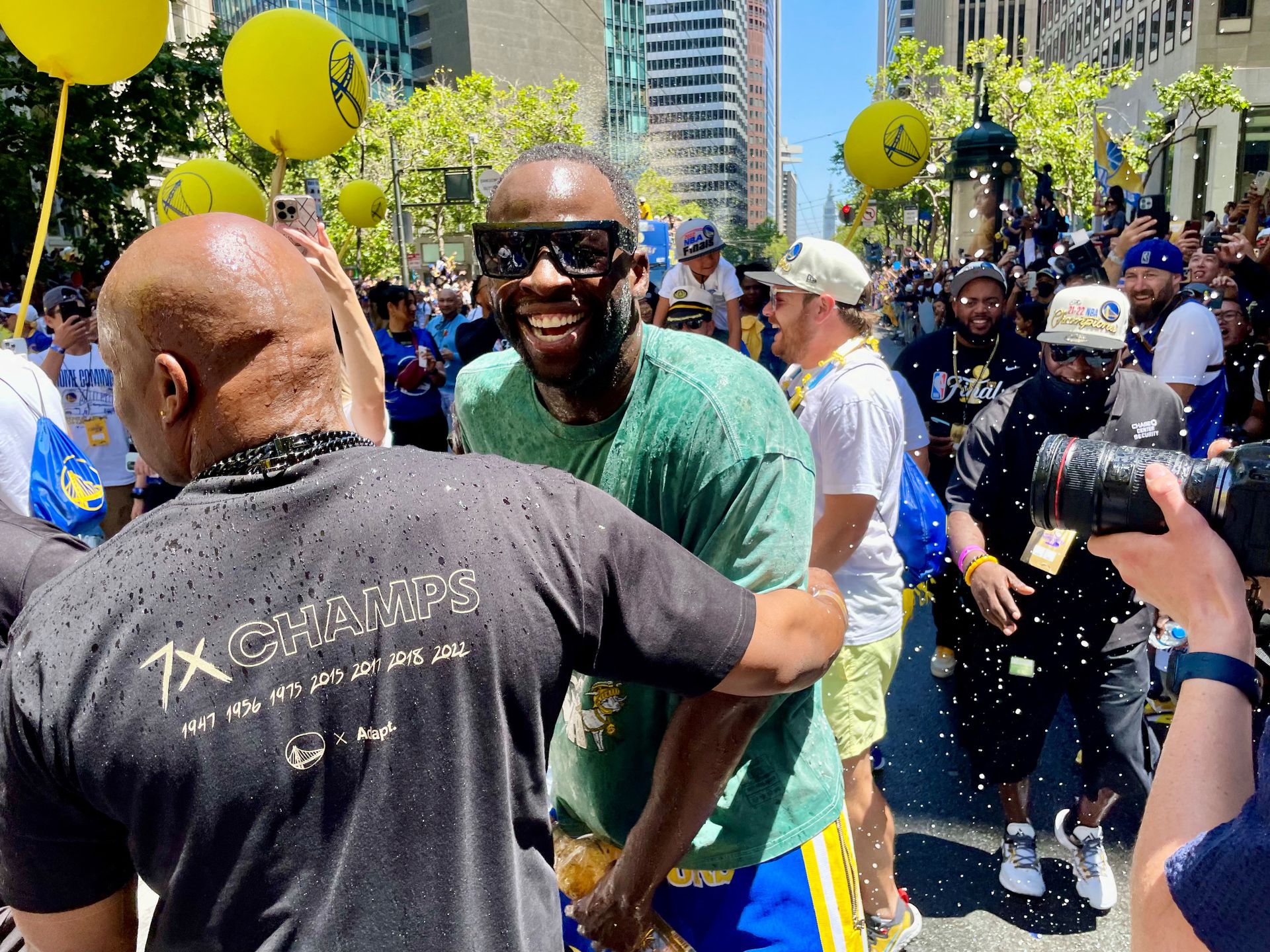 Golden State Warriors power forward Draymond Green celebrates the team's championship with fans at a parade on Market Street, in San Francisco, California, June 20, 2022.