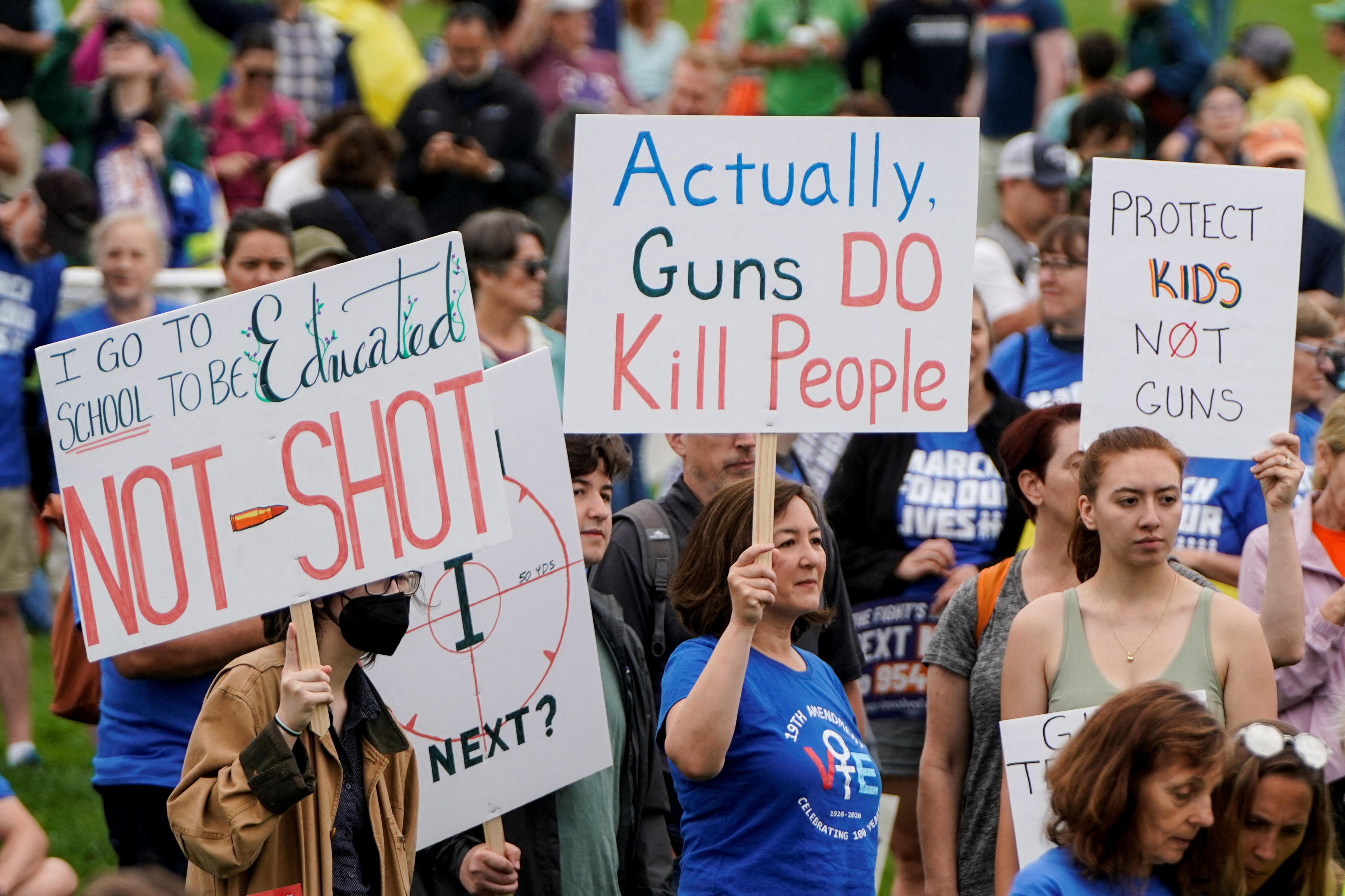 Demonstrators hold placards as they take part in the “March for Our Lives,” one of a series of nationwide protests against gun violence, in Washington, D.C., June 11, 2022. 