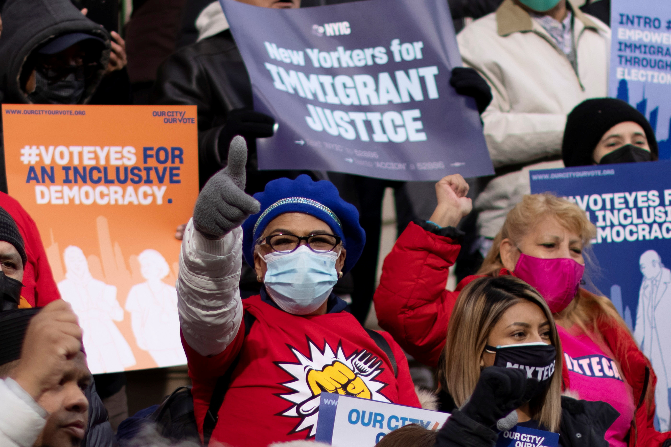 People take part in a rally “Victory Rally” to allow non-citizen NYC residents to vote in local elections, at the steps of the New York City Hall, Dec. 9, 2021.
