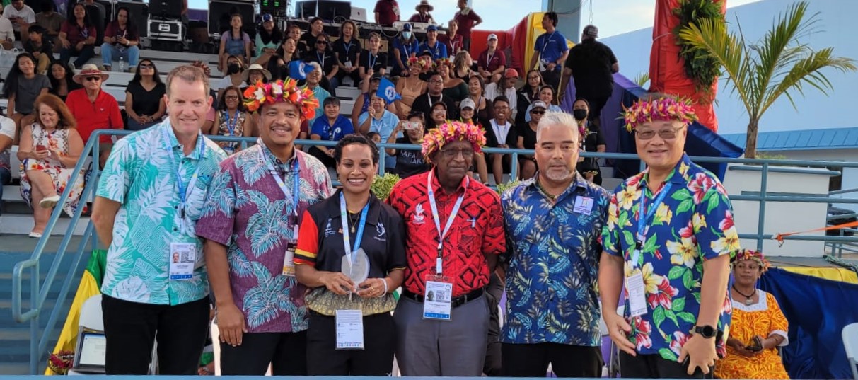 Top Athlete female awardee Dika Toua of Papua New Guinea, center, poses for a photo with Pacific Mini Games CEO Andrew Minogue, acting Gov. Jude Hofschneider, Northern Marianas Pacific Mini Games 2022 CEO Ben Babauta, Pacific Games Council President Vidhya Lakhan, Northern Marianas PMG 2022  Chairman Marco Peter and Northern Marianas Sports Association President Jerry Tan.