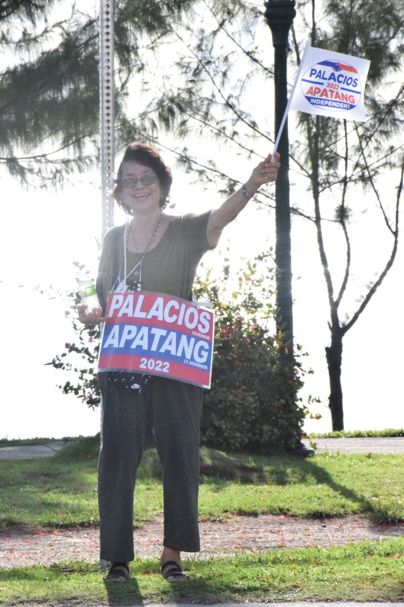 Former Saipan Mayor Marianne DLG Tudela displays Palacios-Apatang campaign signs.