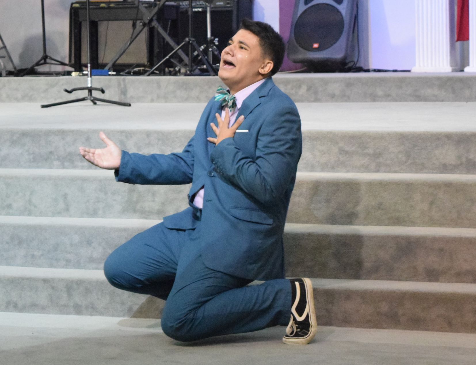 Marianas High School's Jonathan Wolf performs a humorous interpretation piece in the Grace Christian Academy auditorium on Tuesday.