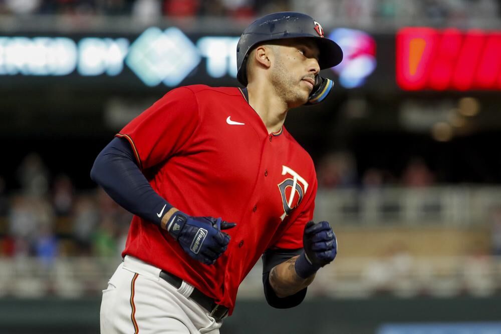 Minnesota Twins' Carlos Correa runs the bases on his solo home run against the Kansas City Royals in the fourth inning of a baseball game Friday, May 27, 2022, in Minneapolis.