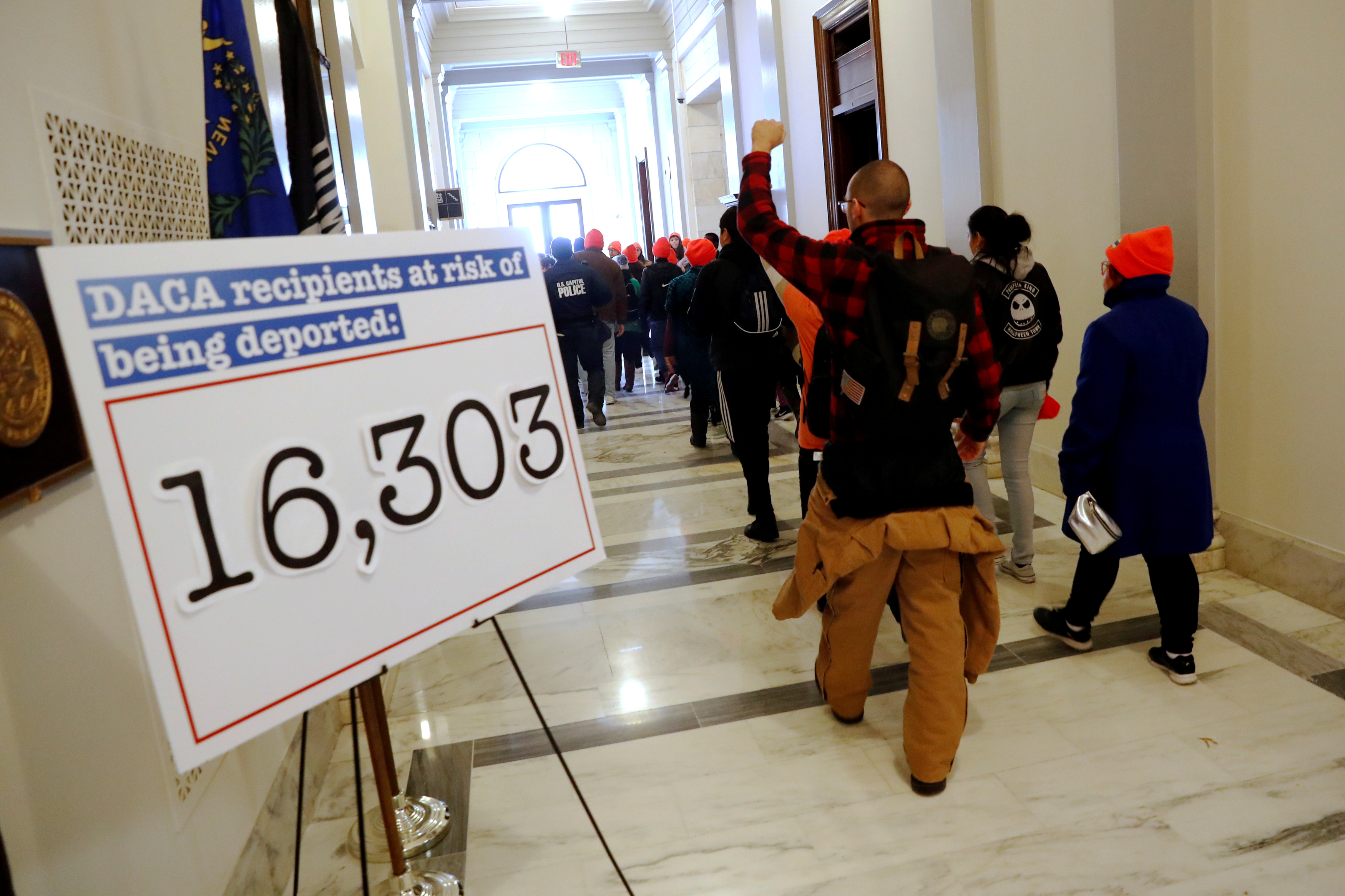 Demonstrators calling for new protections for so-called "Dreamers," undocumented children brought to the U.S. by their immigrant parents, walk through a Senate office building on Capitol Hill in Washington, D.C. Jan. 17, 2018.