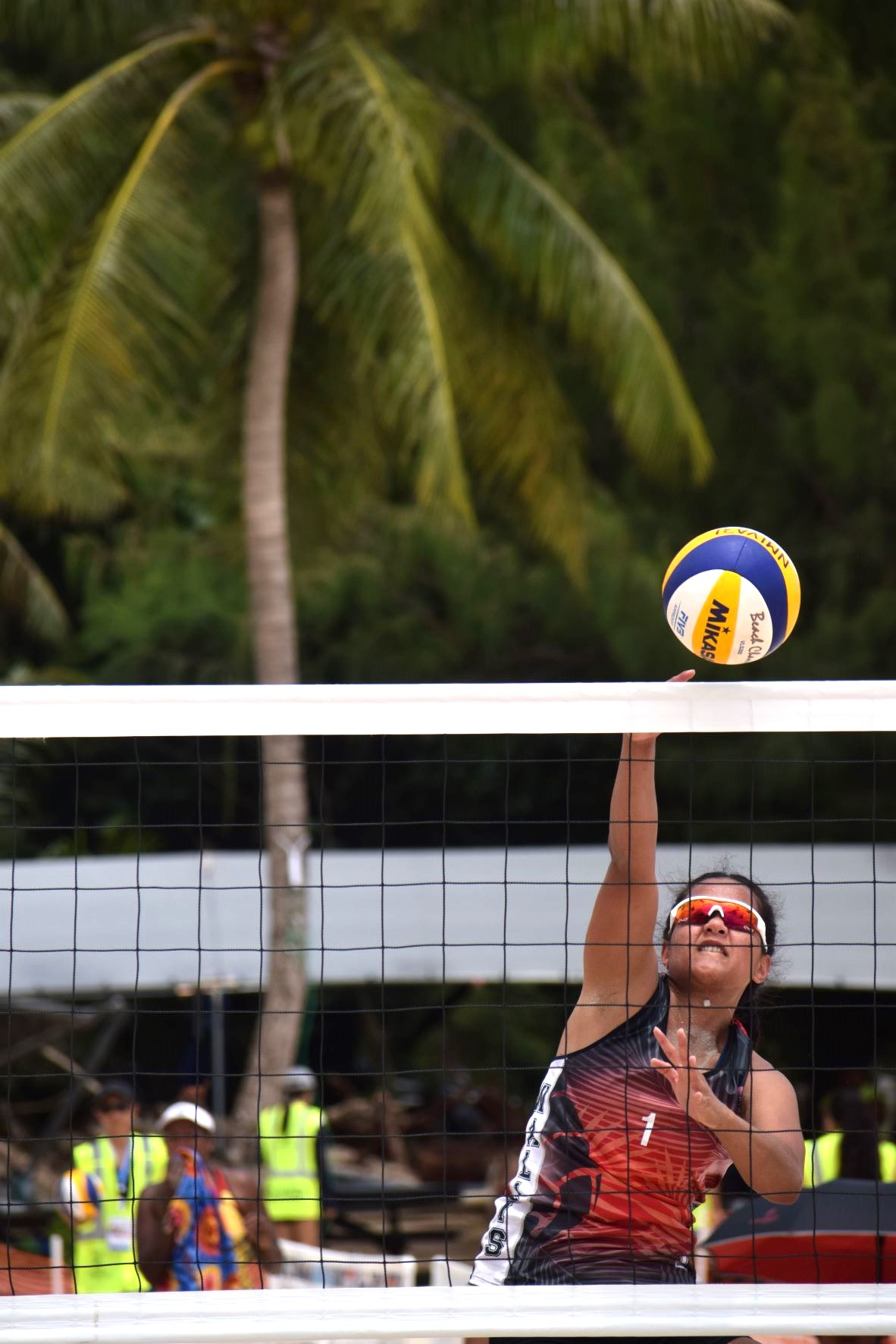 Wallis & Futuna's Tekela Fiafialoto hits a spike against the NMI in the beach volleyball event of the 2022 Pacific Mini Games at the Crowne Plaza Resort beach on Wednesday.