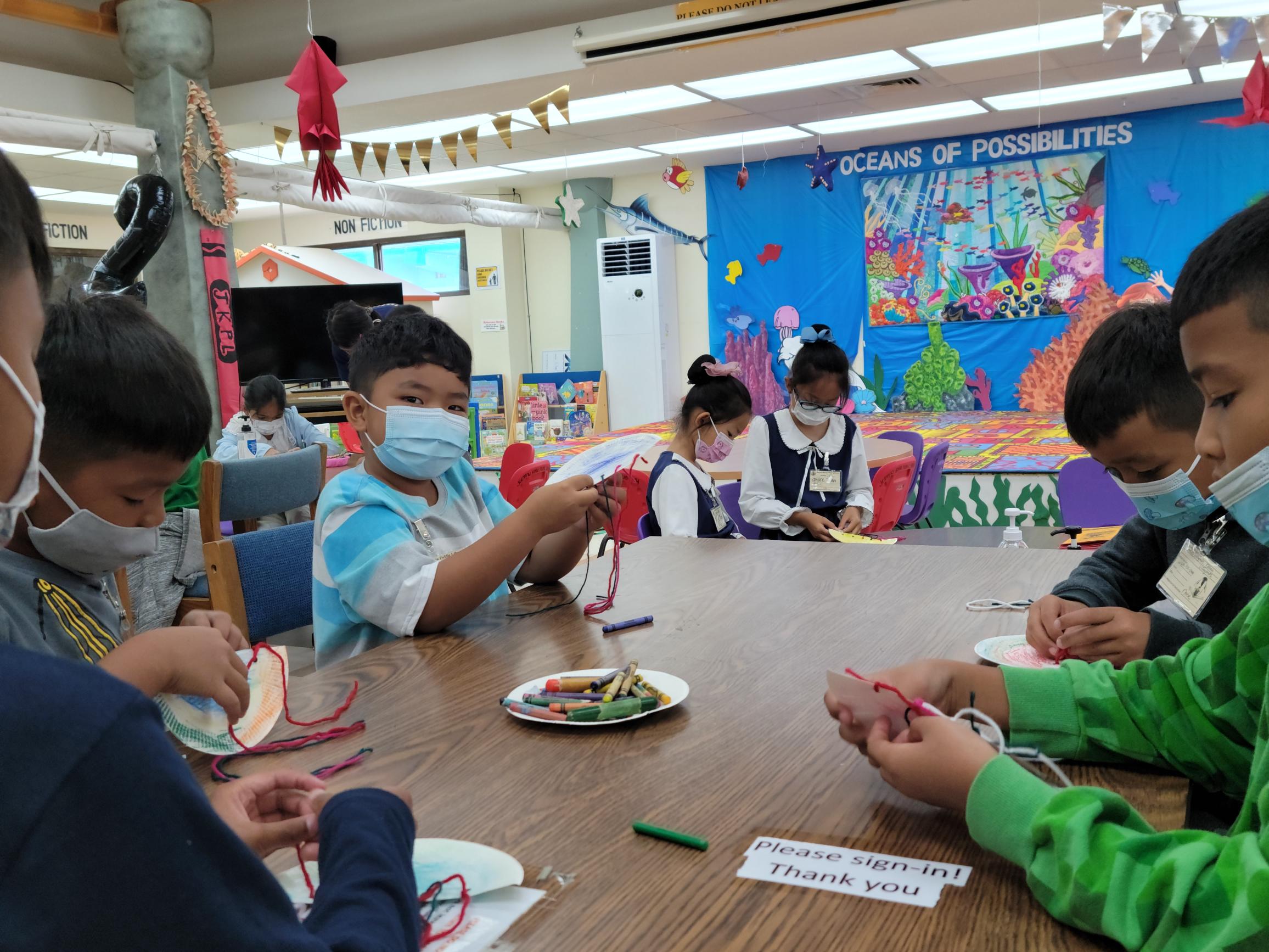Children participate in arts and crafts activities as part of Joeten Kiyu Public Library’s Summer Reading Program.