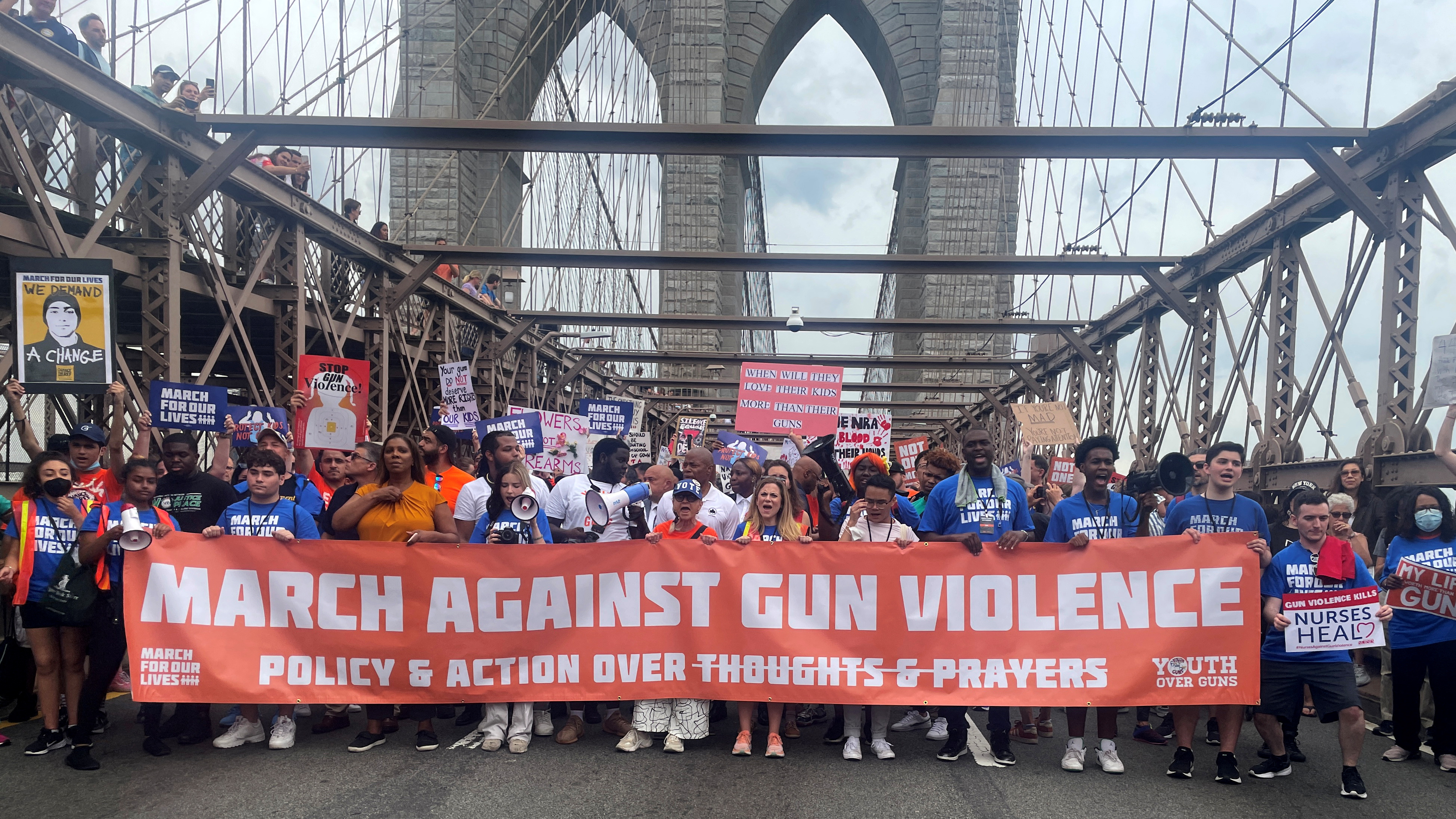 People cross the Brooklyn Bridge as they attend "March for Our Lives" rally, one of a series of nationwide protests against gun violence, New York City, June 11, 2022.
