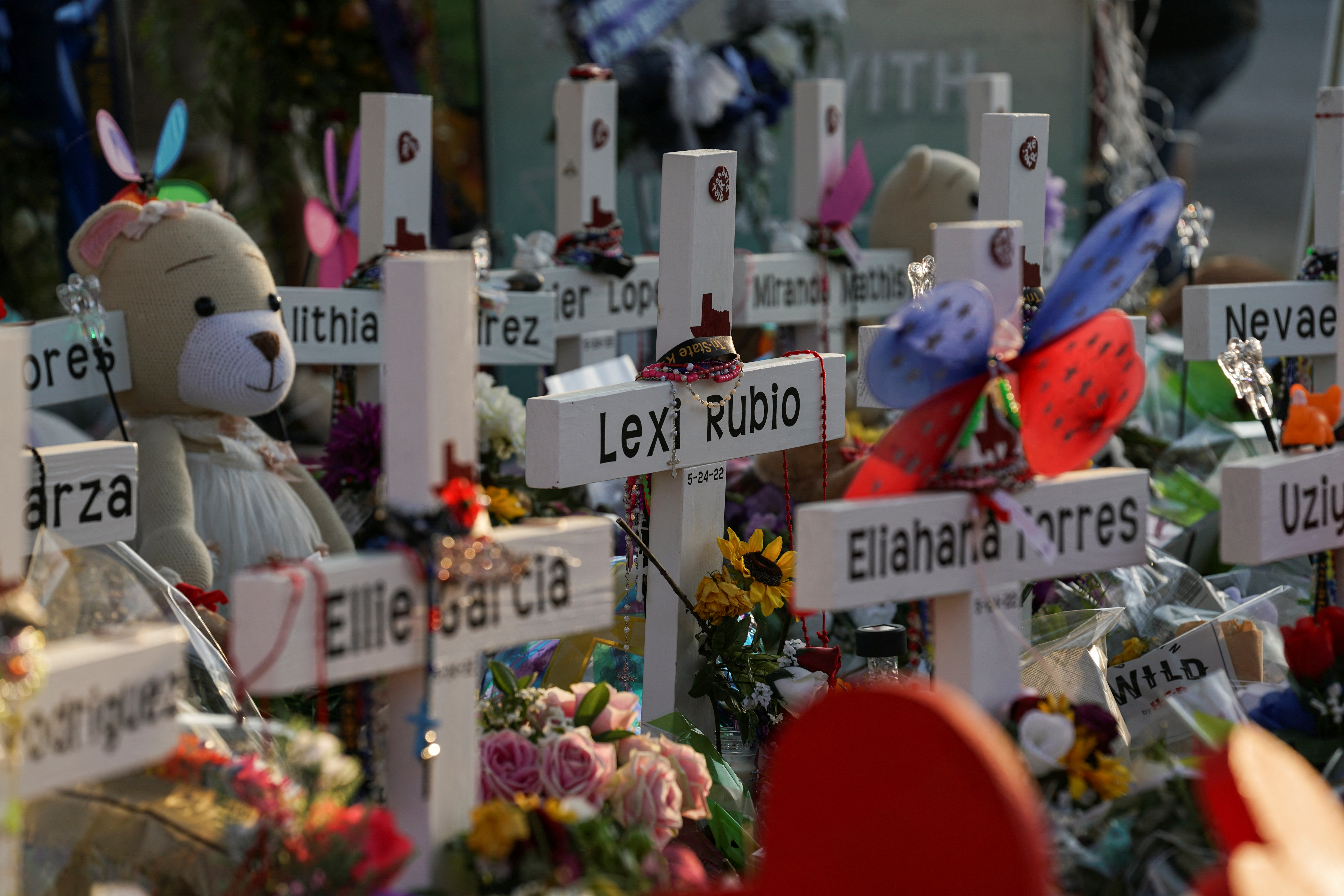 Flowers, toys, and other objects to remember the victims of a school mass shooting that resulted in the death of 19 children and two teachers are seen at a memorial at Robb Elementary School in Uvalde, Texas, May 30, 2022.