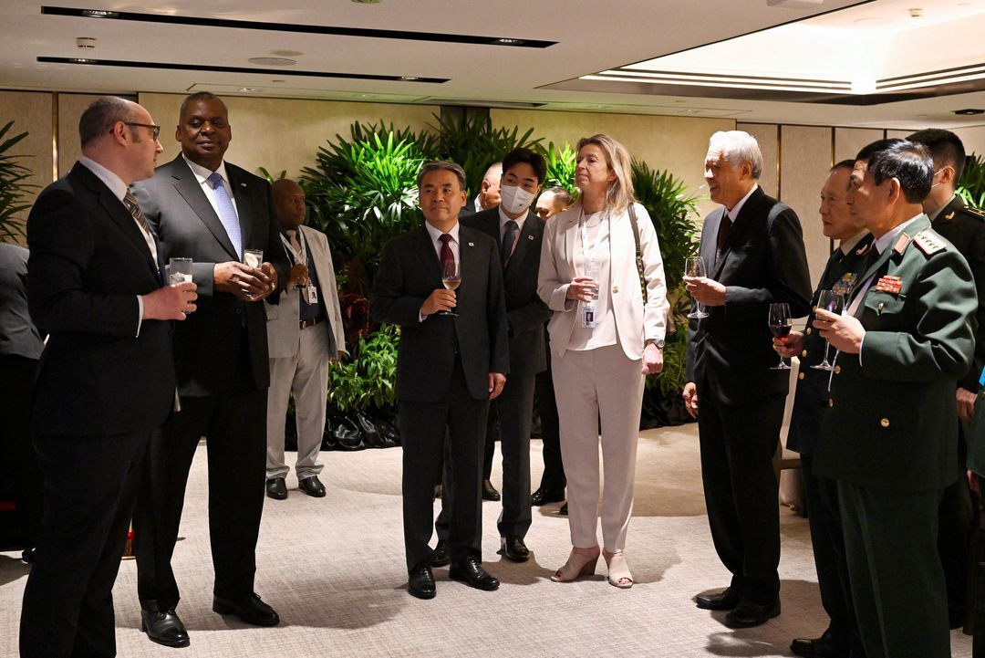 Ukraine Deputy Foreign Minister Dmytro Senik, U.S. Defense Secretary Lloyd Austin, South Korea Defense Minister Lee Jong-sup, Netherlands Defense Minister Kajsa Ollongren, Singapore Defense Minister Ng Eng Hen, China's State Councilor and Defense Minister Gen. Wei Fenghe and Laos' Maj. Gen. Chanthong Sonetaath chat before the ministerial working lunch during the 19th Shangri-La Dialogue in Singapore on June 11, 2022.