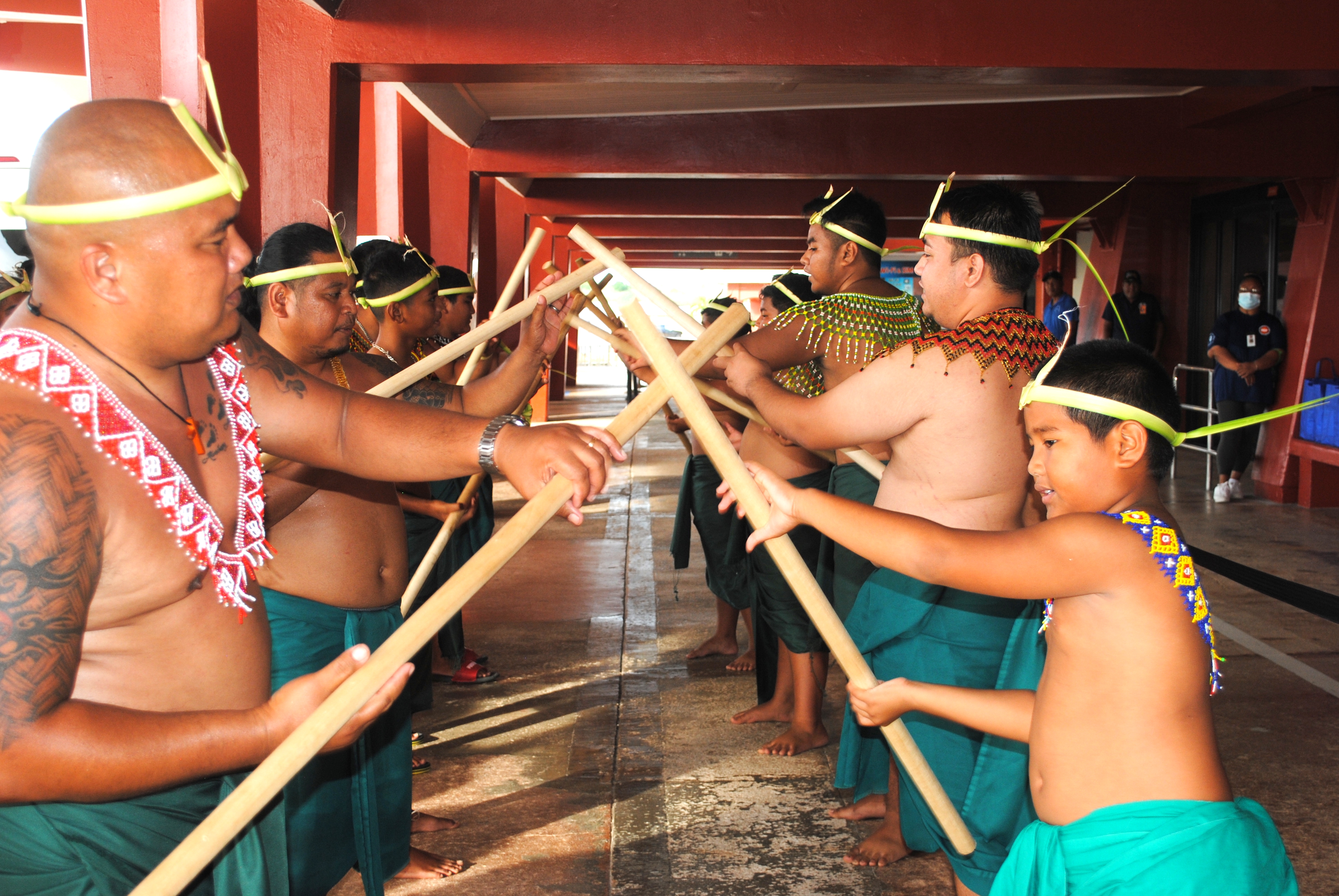 Local cultural dancers perform at the airport for the Pacific Mini Games athletes who arrived on Saipan Sunday.