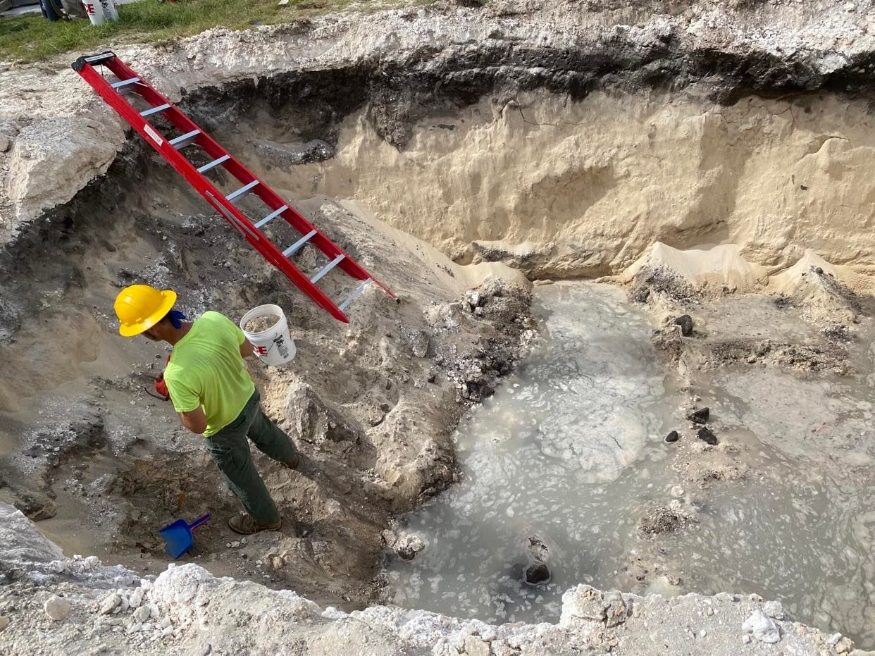 IRP Lead Archaeologist Jeremy Freeman collecting soil samples.