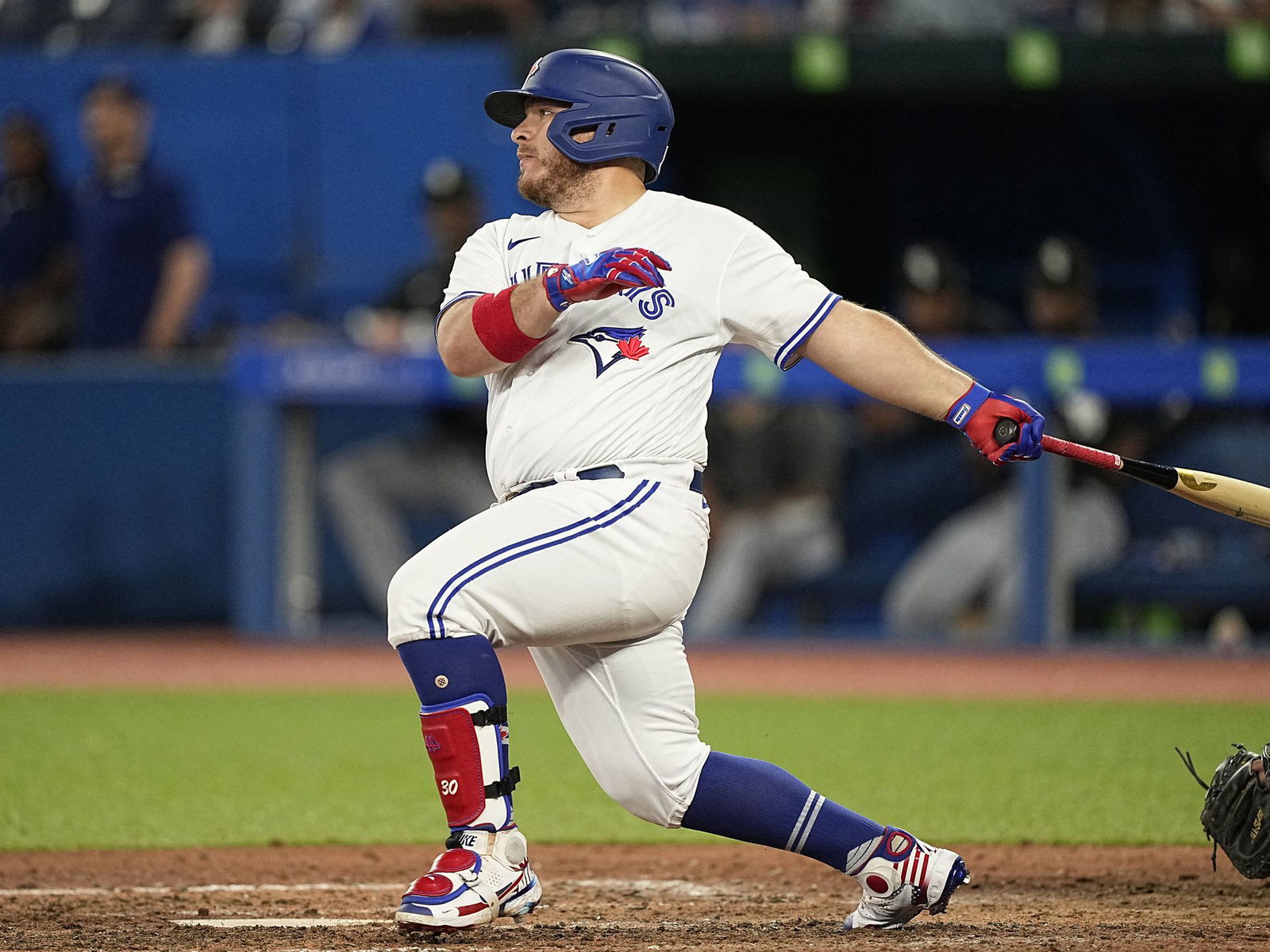 Toronto Blue Jays designated hitter Alejandro Kirk (30) hits a single against the Chicago White Sox during the seventh inning at Rogers Centre in Toronto, Ontario on May 31, 2022.