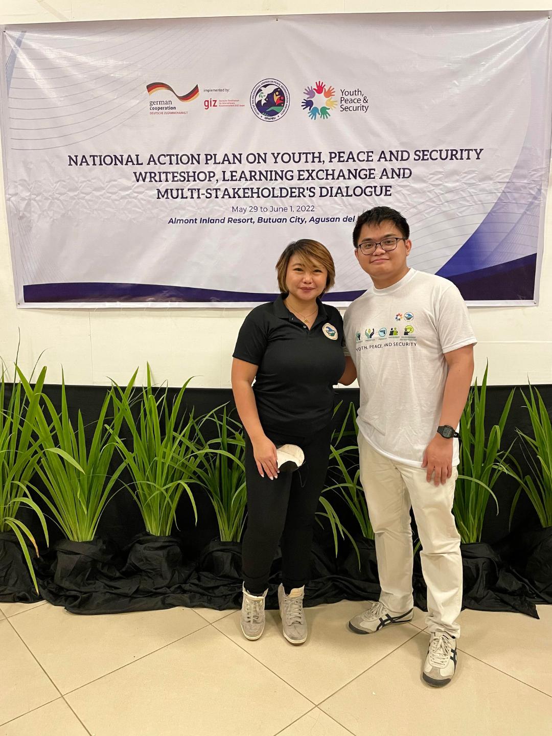 Justin Keith Baquisal, national vice chairperson of the National Youth Movement for the West Philippine Sea, poses for a photo with Vanessa Pallarco, director of the Social Healing and Peacebuilding Department of the Office of the Presidential Adviser on Peace, Reconciliation, and Unity in Butuan City, the Philippines.