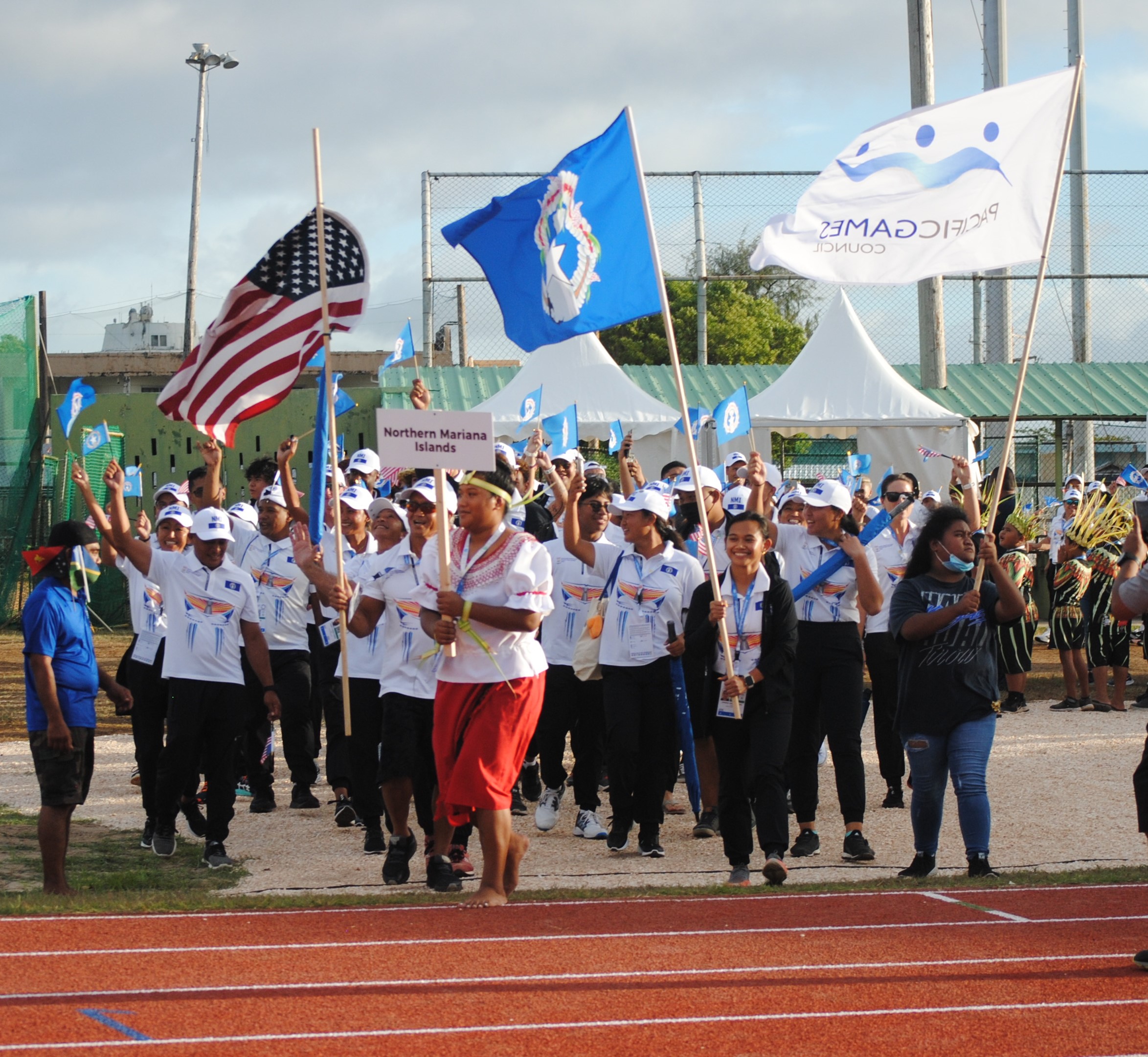 NMI athletes and coaches make their way to the Oleai Track & Field during the opening ceremony.