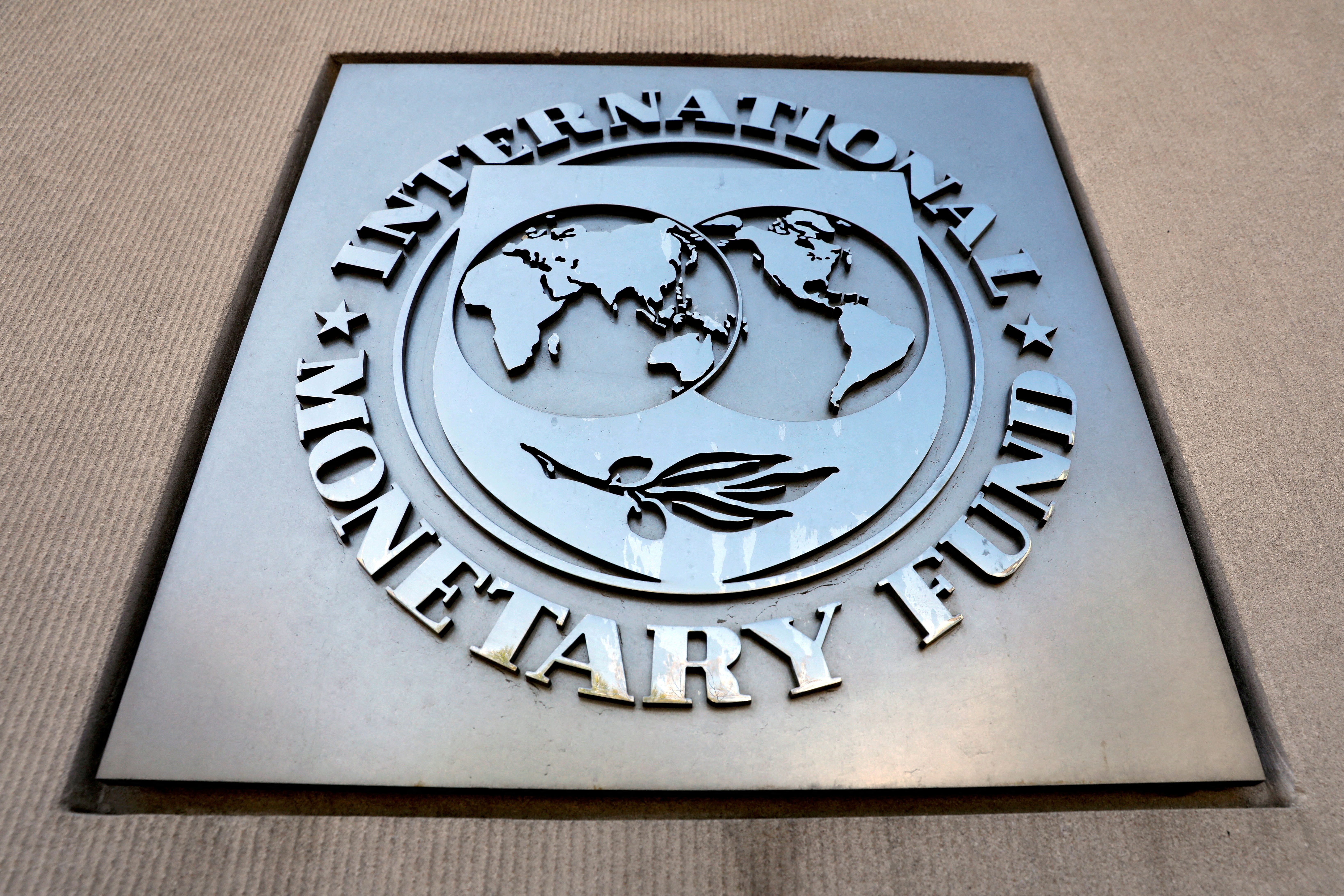 International Monetary Fund logo is seen outside the headquarters building during the IMF/World Bank spring meeting in Washington, D.C., April 20, 2018.
