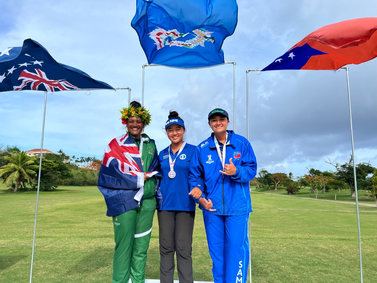 2022 Pacific Mini Games women's golf gold medalist Zhimin Jin of the NMI, center, with silver medalist Rotana Howard of the Cook Islands and bronze medalist Faith Vui of Samoa.