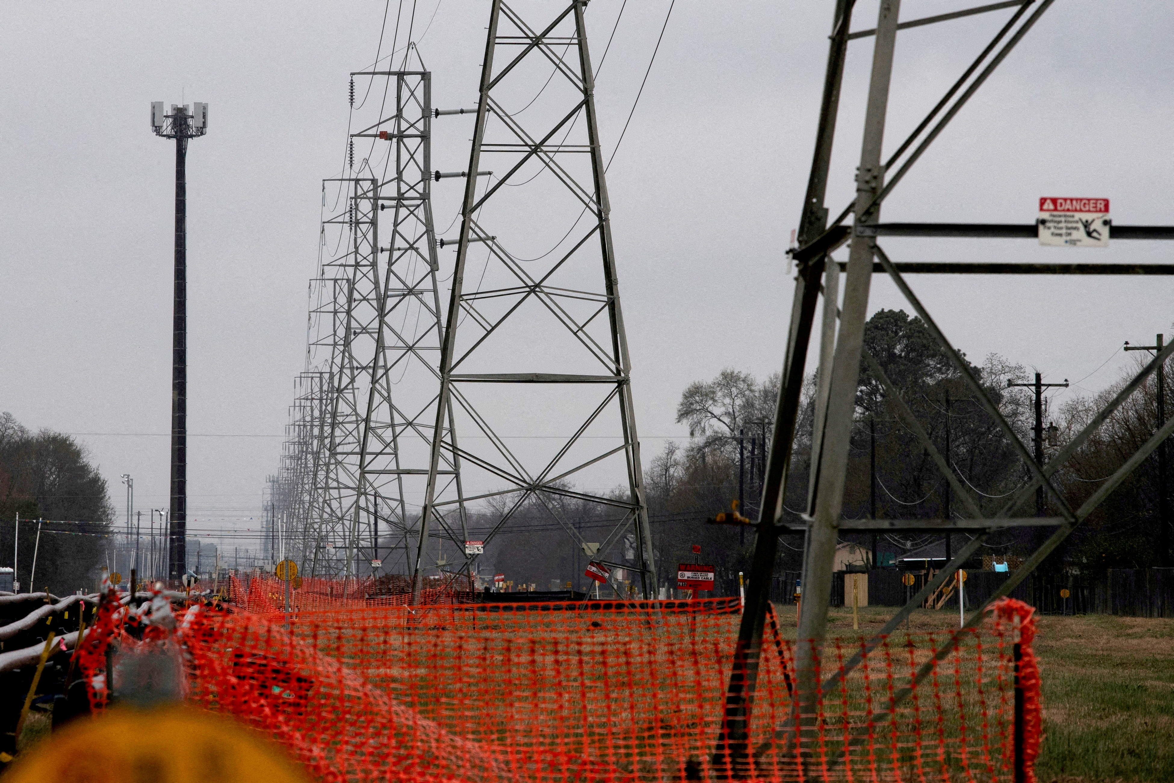 Overhead power lines are seen during record-breaking temperatures in Houston, Texas, Feb. 17, 2021.
