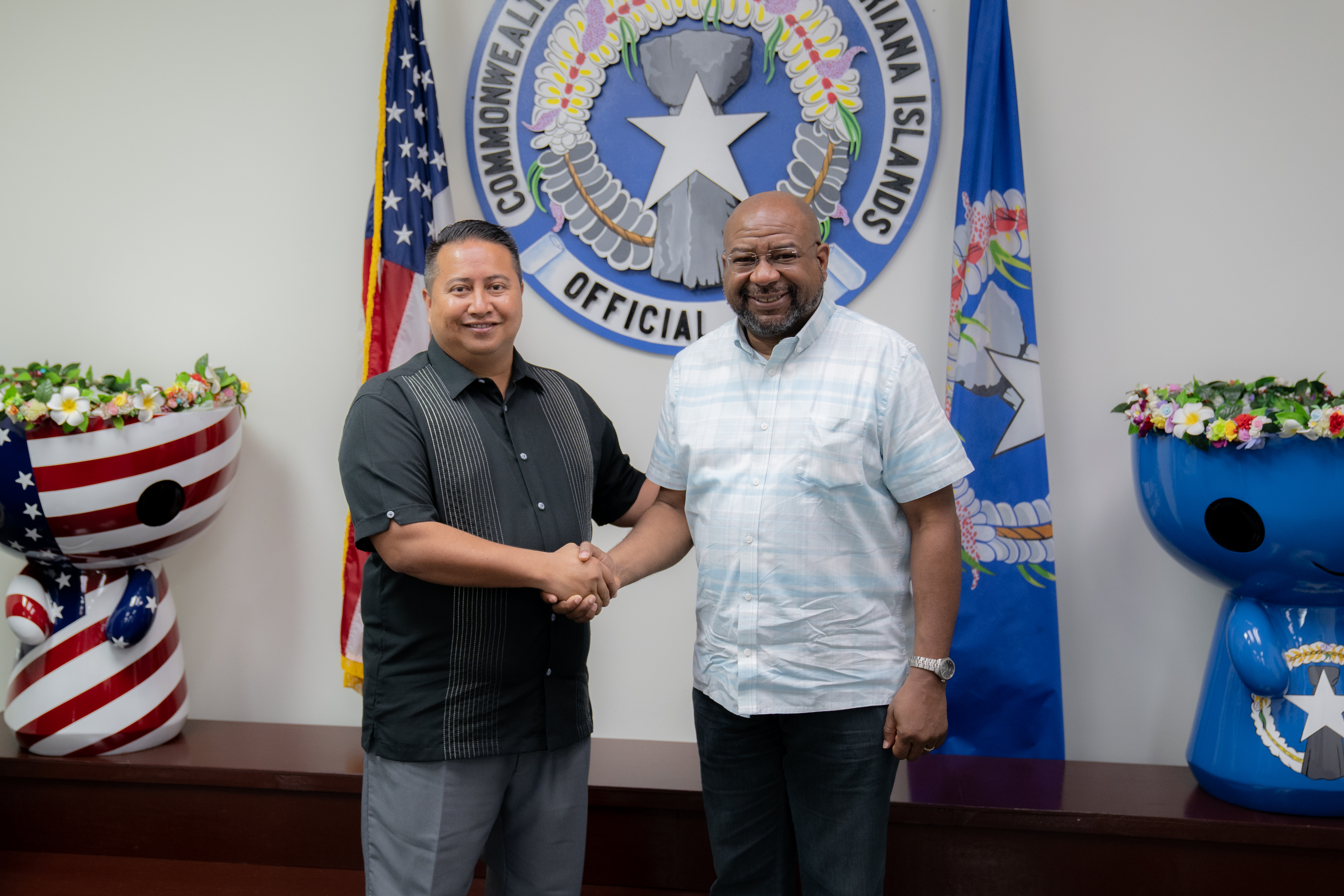 Gov. Ralph DLG Torres, left, shakes hands with U.S. Department of the Interior-Office of Insular Affairs Director of Policy Basil Ottley during a meeting Tuesday at the governor’s office on Capital Hill.