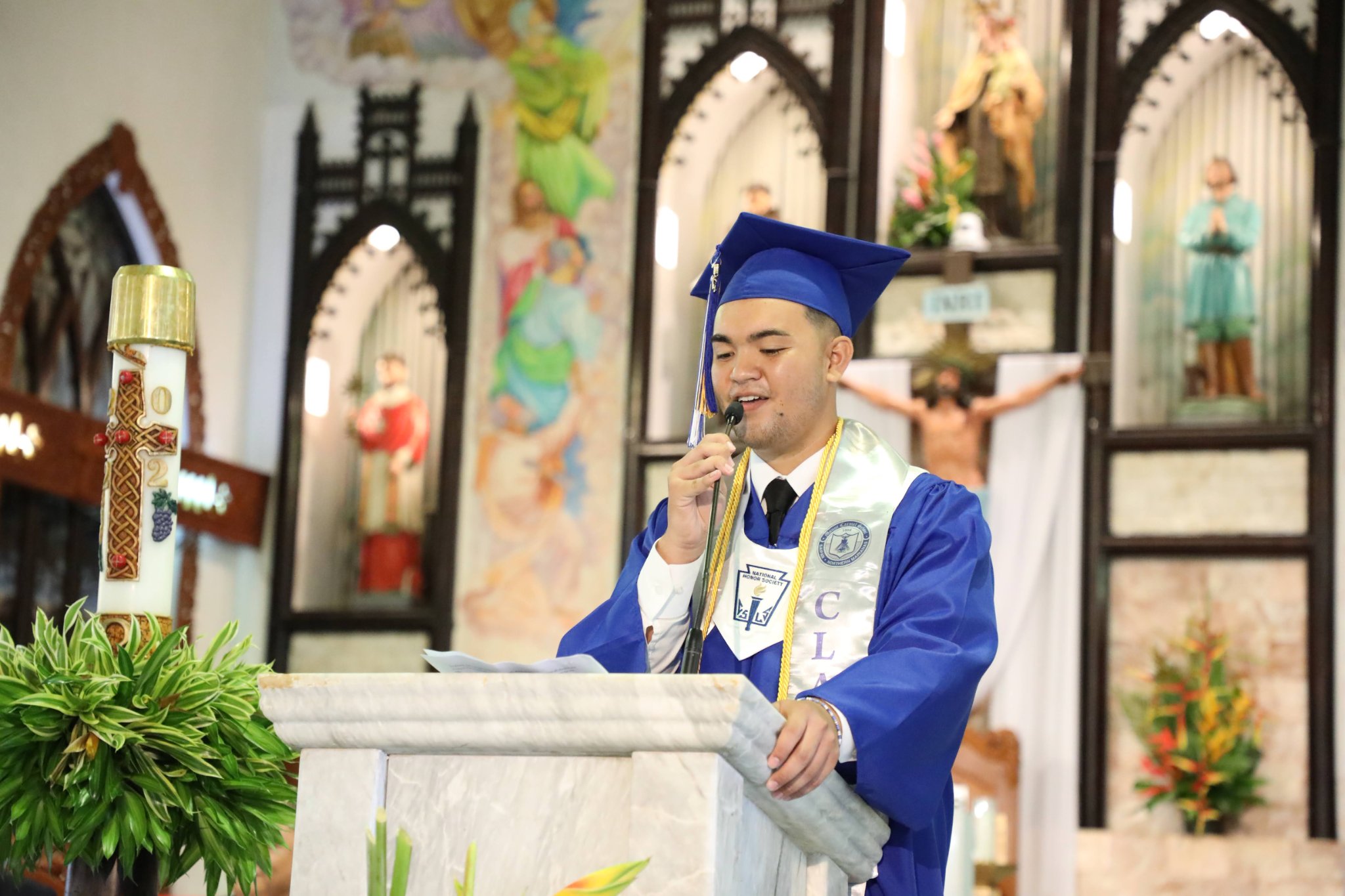 Mount Carmel School Class of 2022 Salutatorian Richard Jesus Mafnas Villagomez delivers his salutatory address during the graduation ceremony at Mount Carmel Cathedral on Friday.