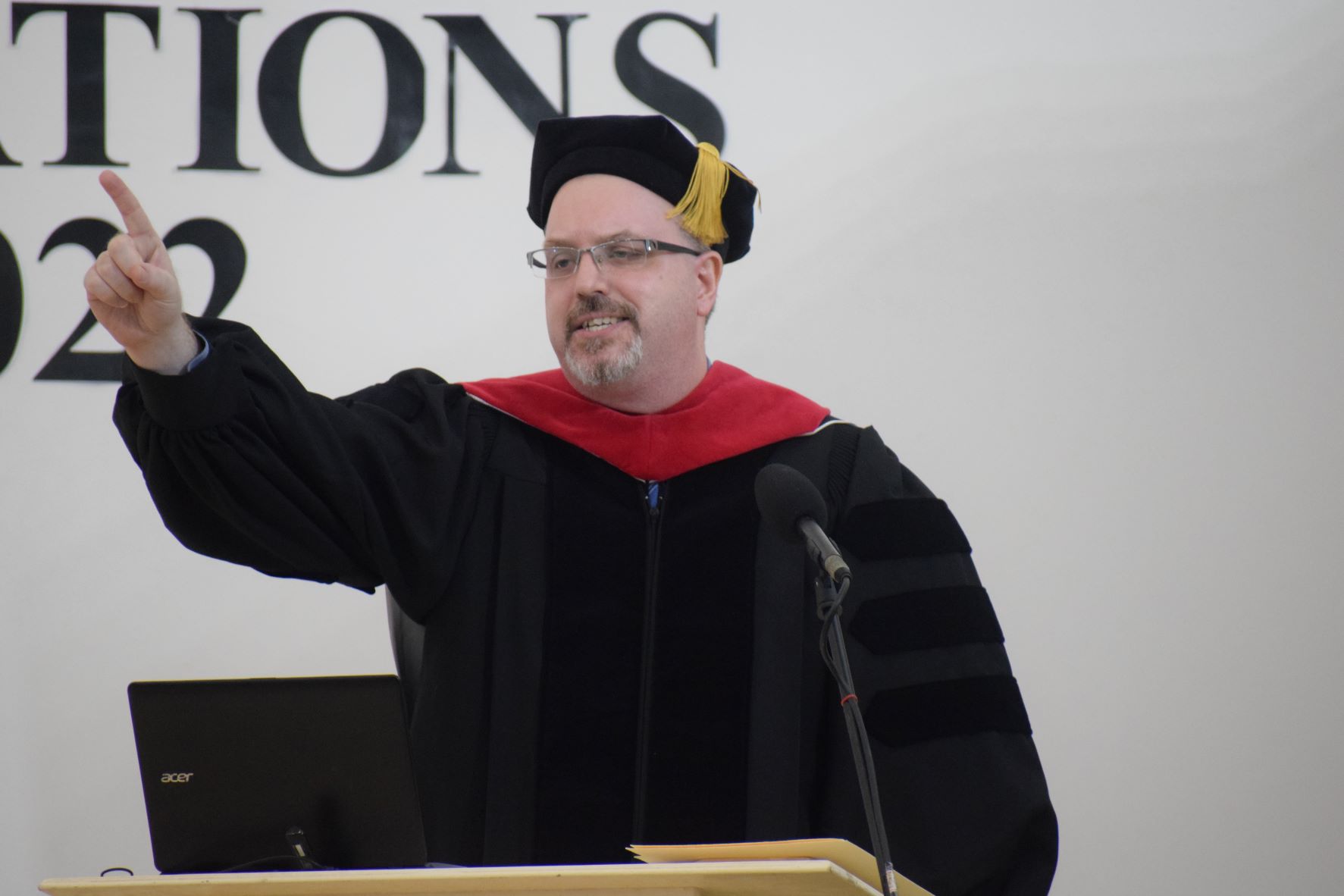 Eucon’s vice president, Dr. Sean Sartler, speaks during the elementary and high school promotion/graduation ceremony in the Eucon auditorium on Friday.