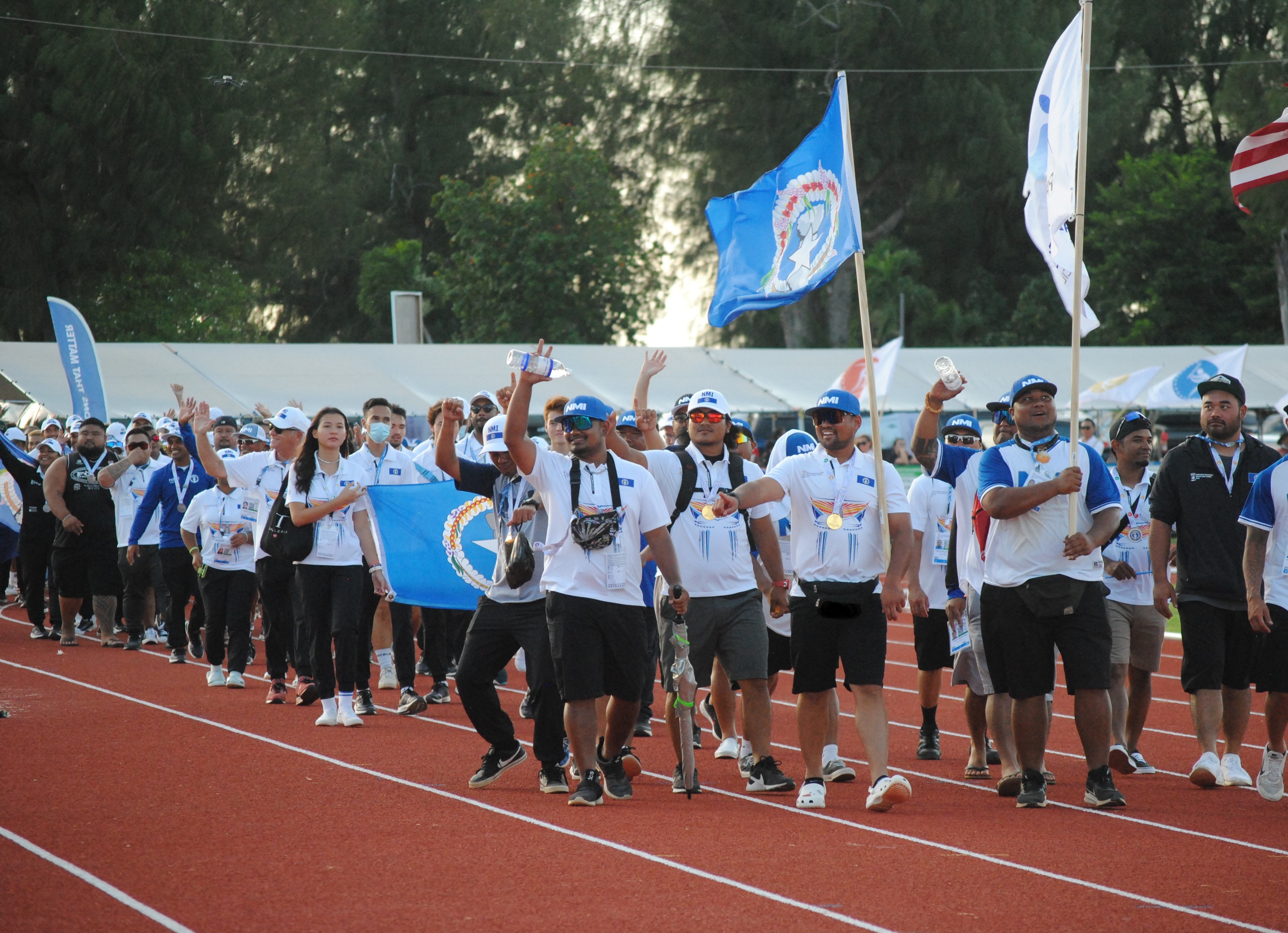 Team NMI athletes and officials acknowledge their supporters during the closing ceremonies of the 2022 Pacific Mini Games Saturday at the Oleai Sports Complex track oval. 
