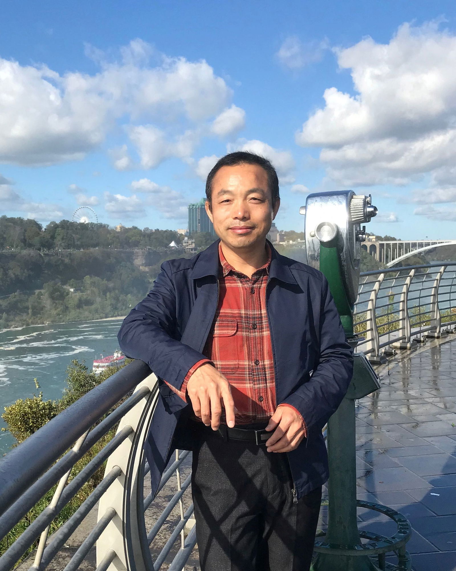 Human rights lawyer Ding Jiaxi poses for a picture at the Niagara Falls in New York on Oct. 8, 2017 in this handout image provided by his wife.