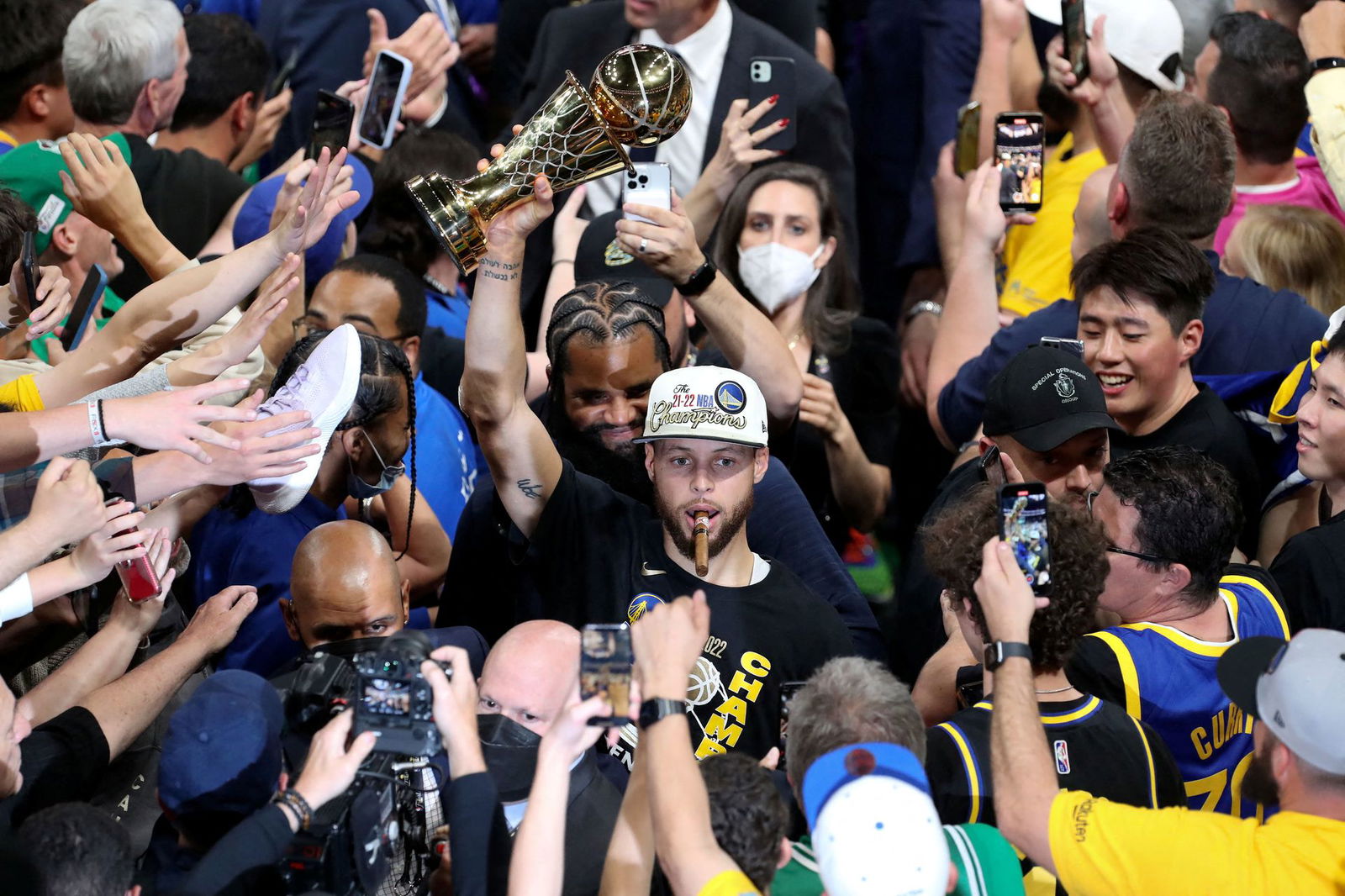 Golden State Warriors guard Stephen Curry (30) holds up the Most Valuable Player trophy after defeating the Boston Celtics in game six in the 2022 NBA Finals at the TD Garden in Boston, Massachusetts on  June 16, 2022.
