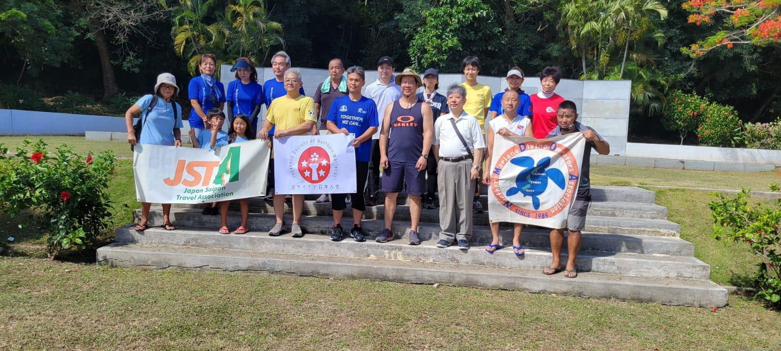 Members of Japan-Saipan Travel Association, Northern Mariana Diving Operators Association, and Japan Society of the Northern Marianas join the Marianas Tourism Month cleanup on May 28, 2022, at the Last Command Post in Marpi, Saipan.