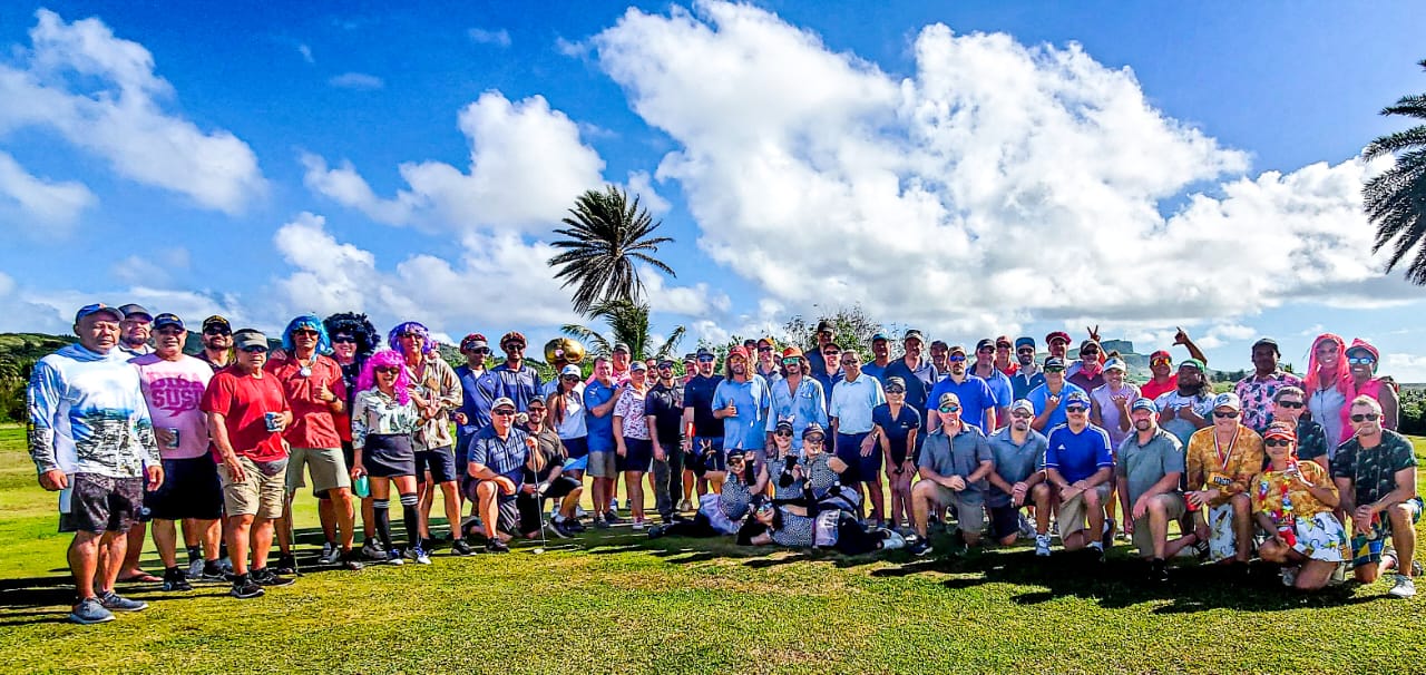 Participants of the 13th Wollak Golf Classic pose for a photo Sunday at the Kingfisher Golf Links.
