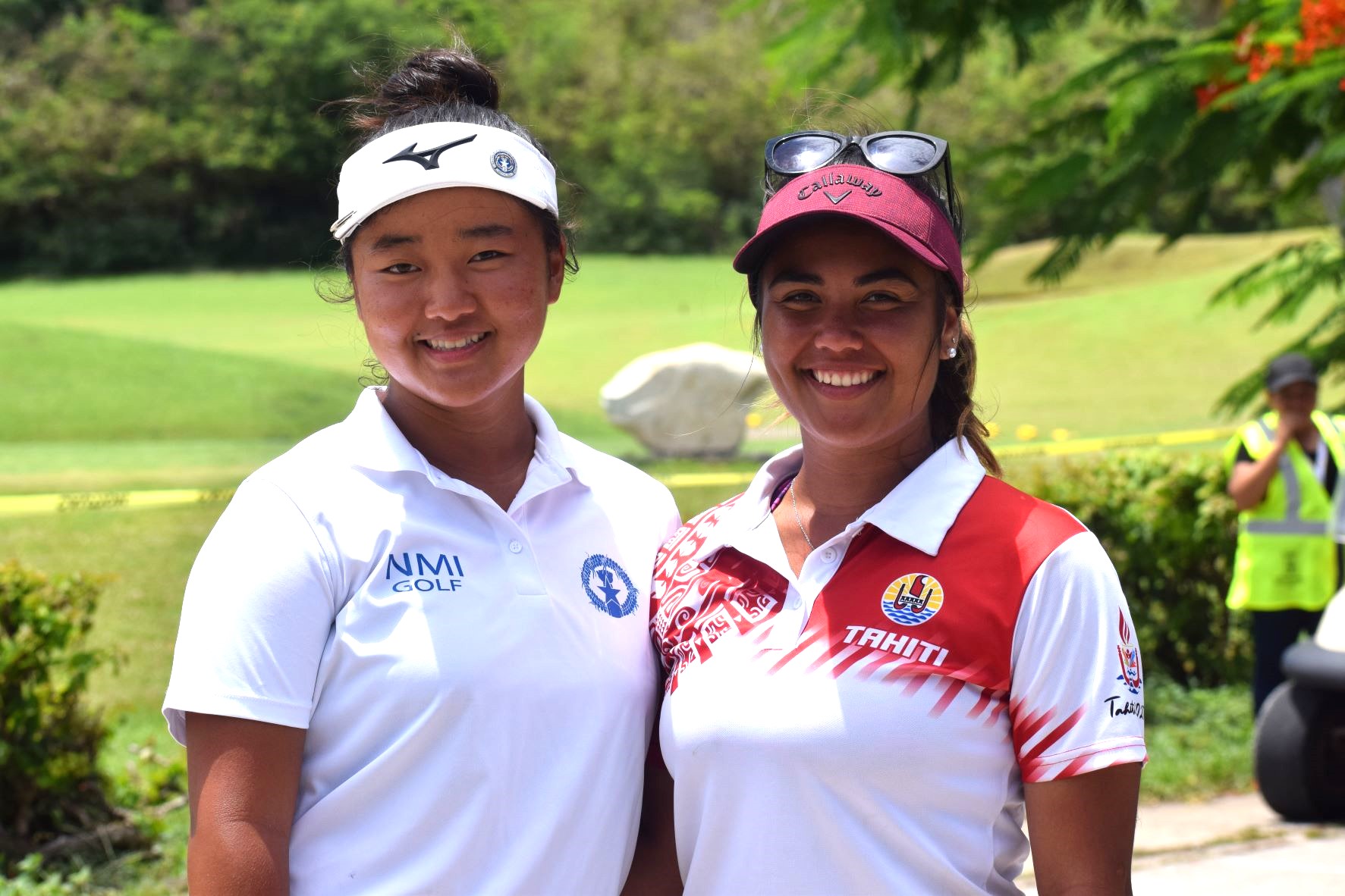The NMI's Zhi Min Jin, left, and Tahiti's Flavia Reid-Amaru pose for photo after completing the 2022 Pacific Mini Games golf round on Thursday at Coral Ocean Resort. 