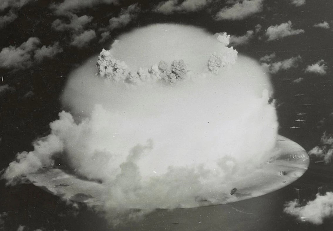 A mushroom cloud rises with ships below during Operation Crossroads nuclear weapons test on Bikini Atoll, Marshall Islands in this 1946 handout provided by the U.S. Library of Congress.