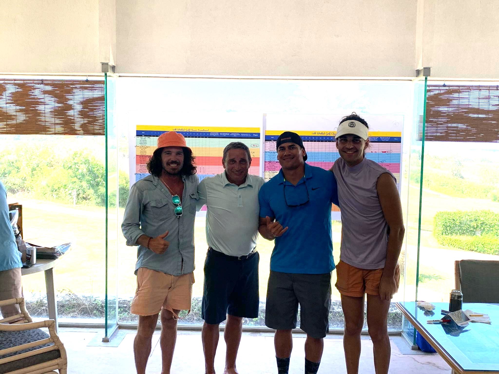 The Putt Buddies: Nick Kelley, Tom Linden, Ed Manibusan, and Dominic Kieffer pose for a photo during the awards ceremony of the 13th Wollak Golf Classic at the Kingfisher Golf Links.