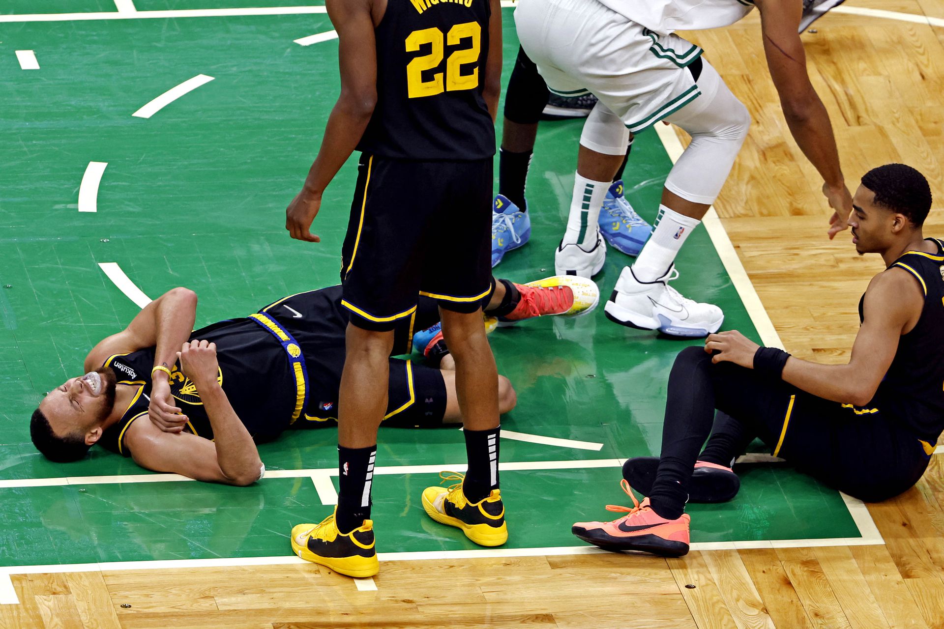 Golden State Warriors guard Stephen Curry (30) reacts to an apparent injury during the fourth quarter against the Boston Celtics in game three of the 2022 NBA Finals at TD Garden in Boston, Massachusetts on June 8, 2022.