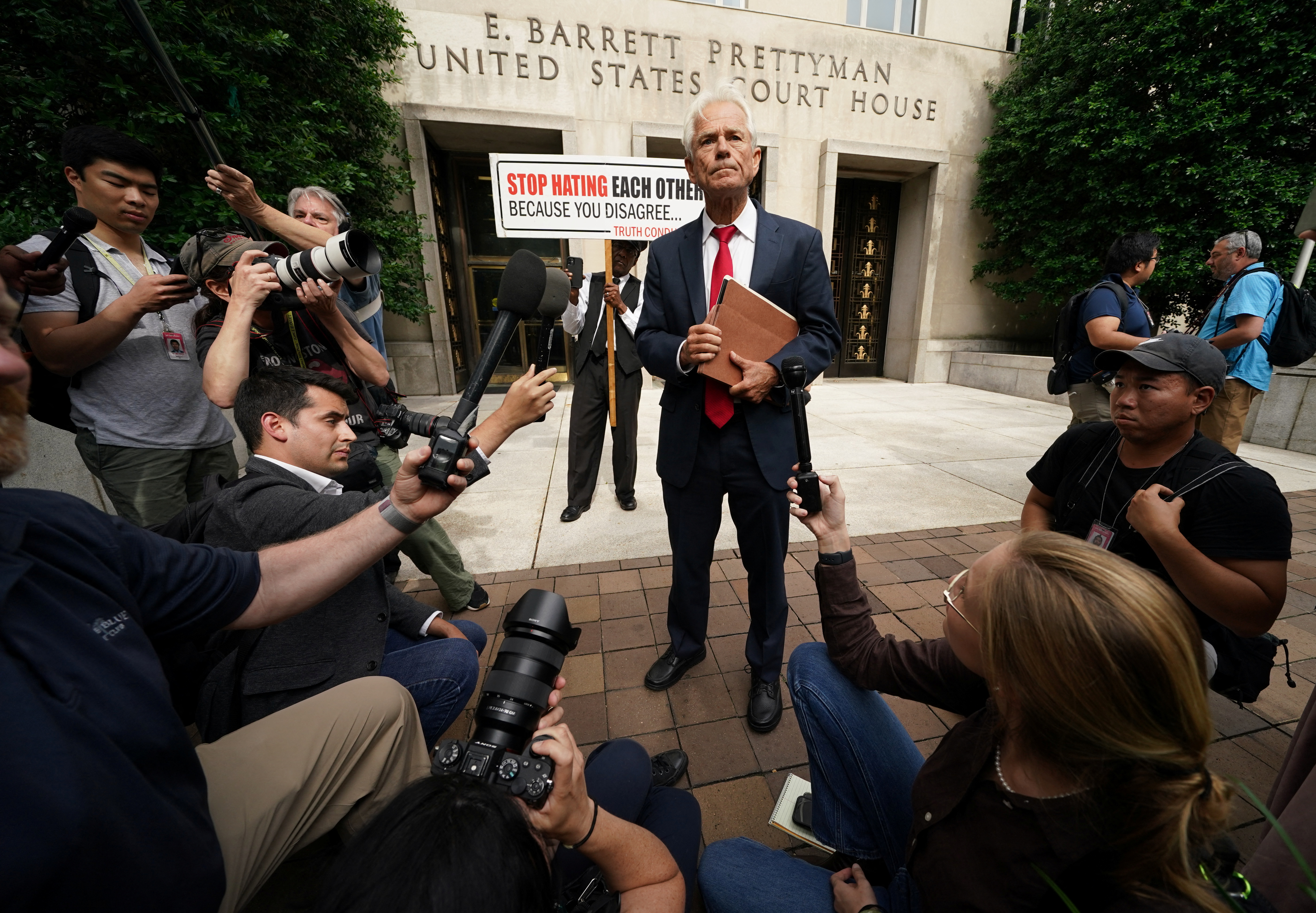 Peter Navarro, former trade adviser to President Donald Trump, speaks to reporters as he departs U.S. District Court after he was indicted on two counts of contempt of Congress for his failure to comply with a subpoena from the House of Representatives committee investigating the Jan. 6 attack on the U.S. Capitol, in Washington, D.C., June 3, 2022.