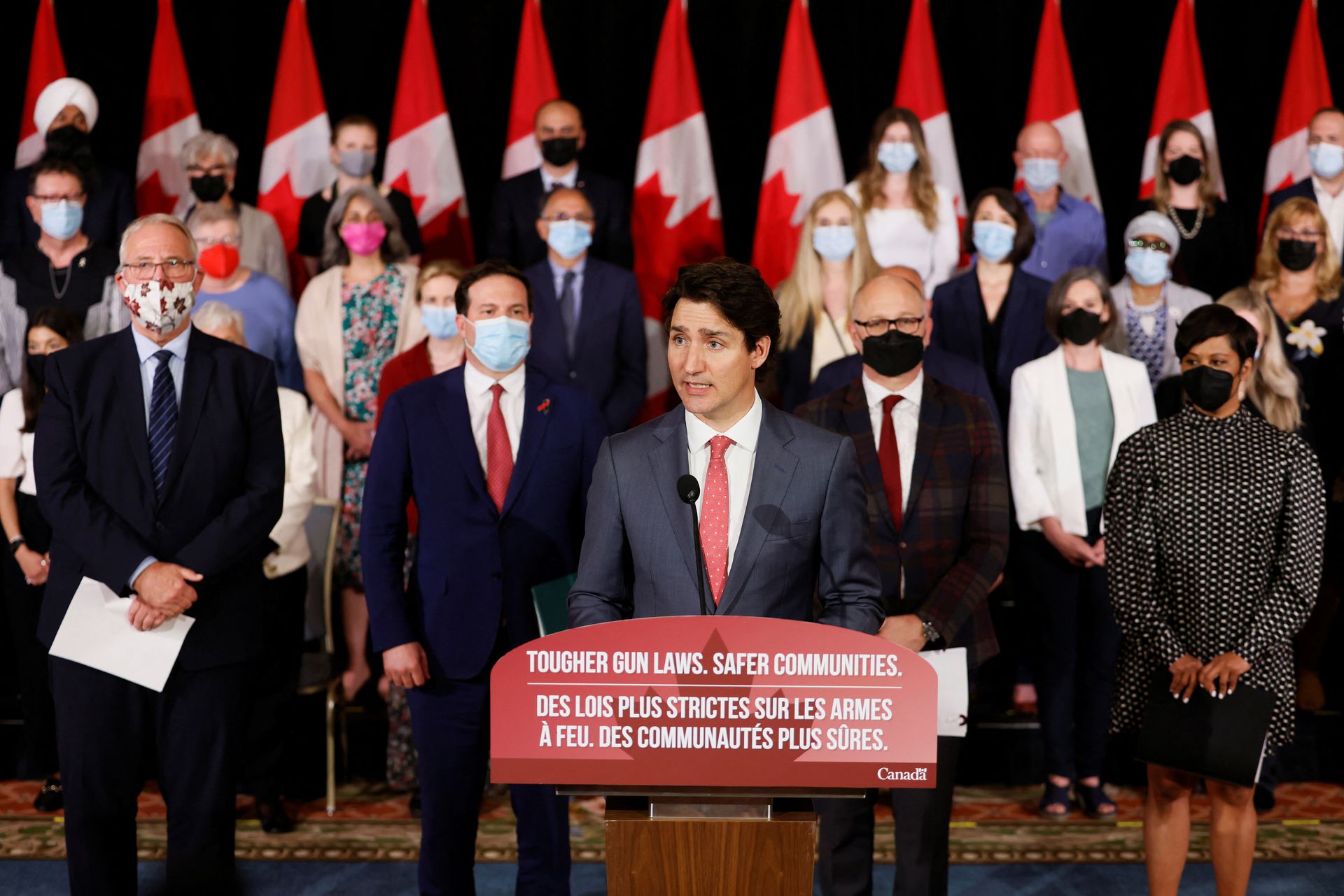 Canada's Prime Minister Justin Trudeau, with government officials and gun-control advocates, speaks at a news conference about firearm-control legislation that was tabled today in the House of Commons in Ottawa, Ontario, Canada, May 30, 2022.