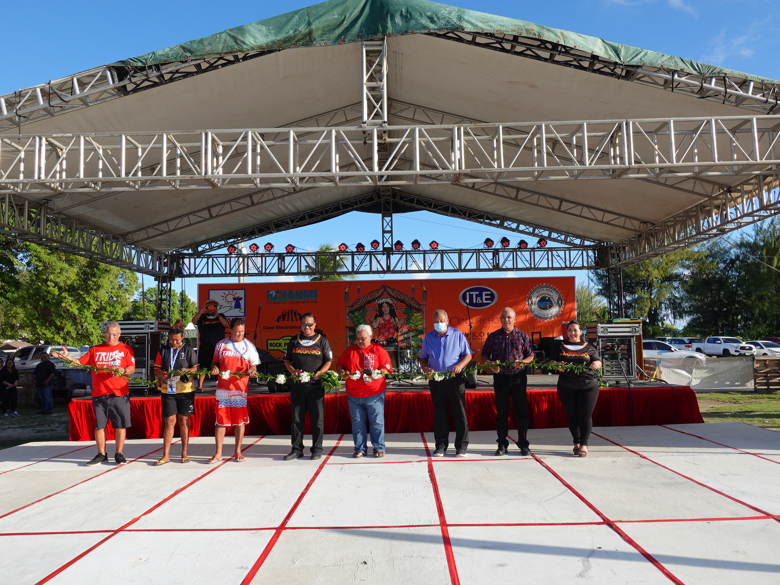 Dignitaries and guests cut a “ti” leaf ribbon to officially open the 23rd Annual Taste of the Marianas International Food Festival & Beer Garden on June 18, 2022 at Garapan Fishing Base on Saipan. From  left,  Rep. Leepan  Guerrero, Pacific  Mini  Games delegates from Papua New Guinea and New Caledonia, acting Gov. Jude Hofschneider, Marianas Visitors Authority Board Chairwoman Viola Alepuyo, Saipan Mayor David Apatang, Rep. Joe Flores, and MVA Managing Director Priscilla M. Iakopo.