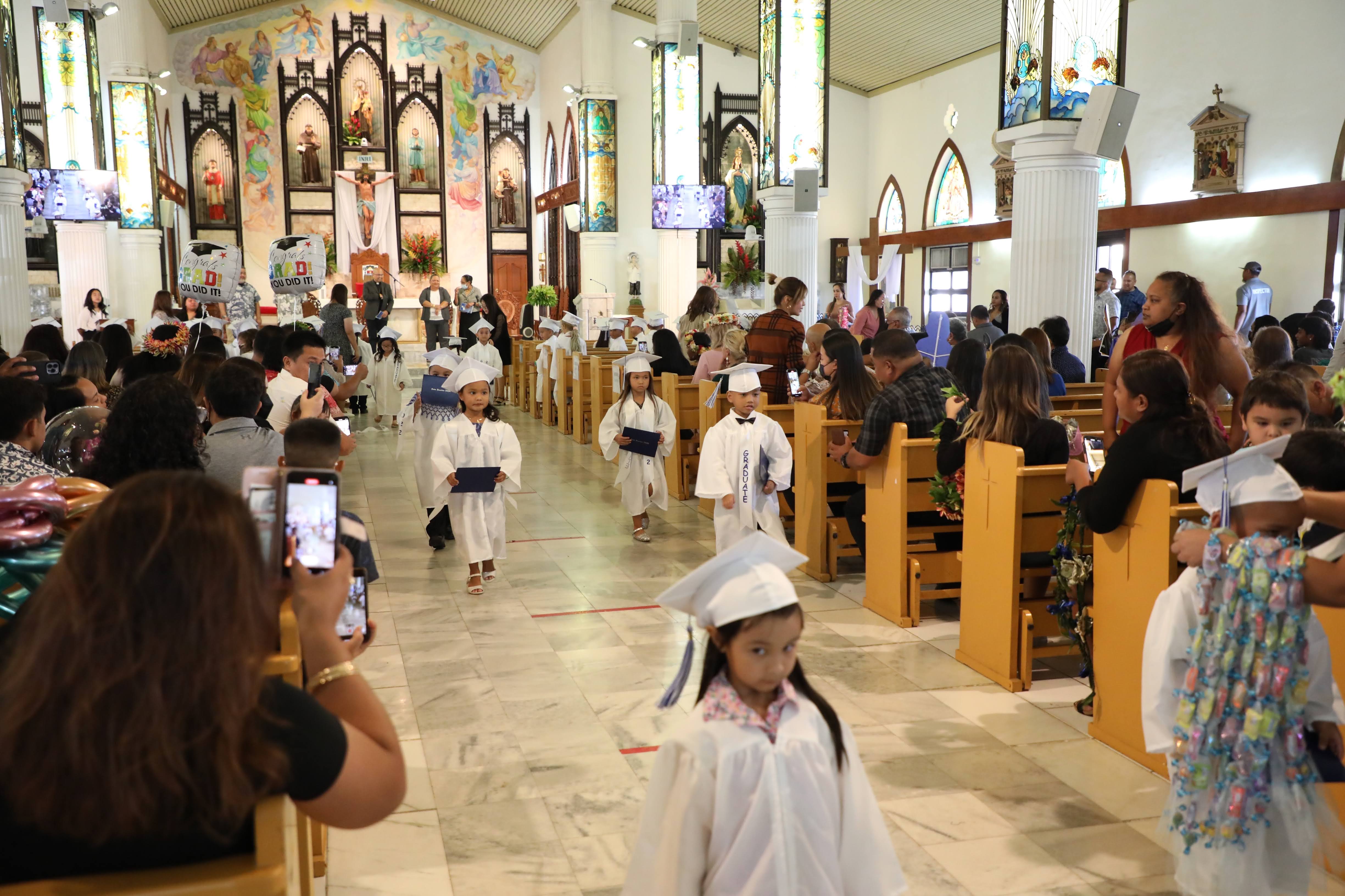 Mount Carmel School’s kindergarten graduates walked down the aisle with pride after their promotion ceremony on June 2, 2022.