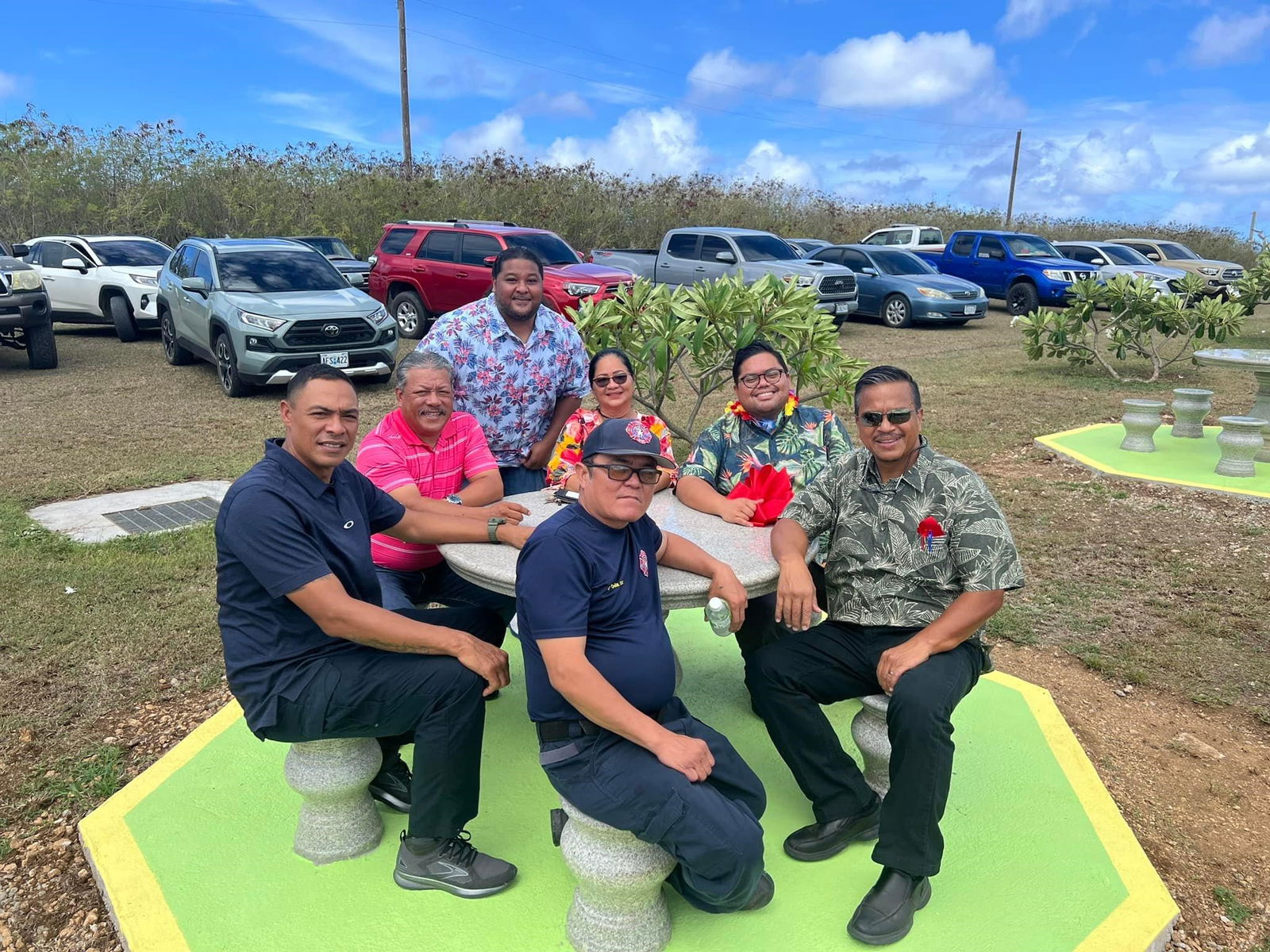 Acting Gov. Jude Hofschneider, Mayor Edwin P. Aldan, Sen. Karl King-Nabors, 18th Tinian Municipal Council Vice Chairwoman Thomasa Mendiola, Director of Homeland Security Dennis Mendiola, PSS Haligi Aware’s Frank Lee Borja, and DFEMS Deputy Commissioner Ray Dela Cruz Jr. sit at a newly installed marble table.