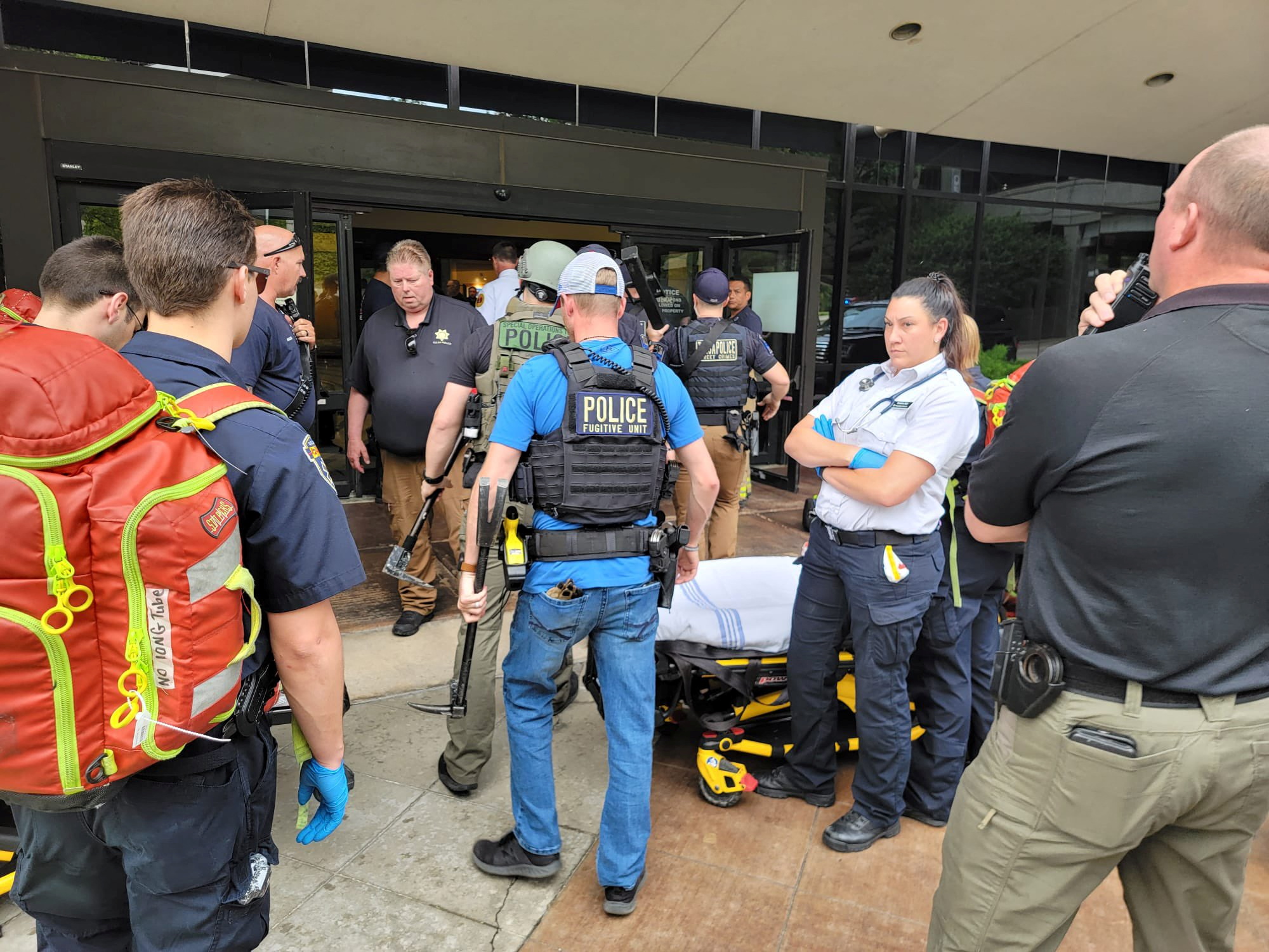 Emergency personnel work at the scene of a shooting at the Warren Clinic in Tulsa, Oklahoma, June 1, 2022.