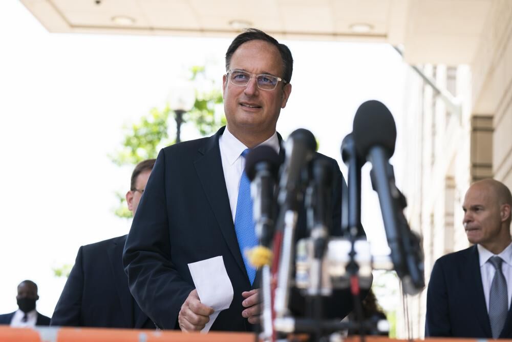 Michael Sussmann, a cybersecurity lawyer who represented the Hillary Clinton presidential campaign in 2016, walks towards the waiting members of the media outside the federal courthouse in Washington, Tuesday, May 31, 2022.
