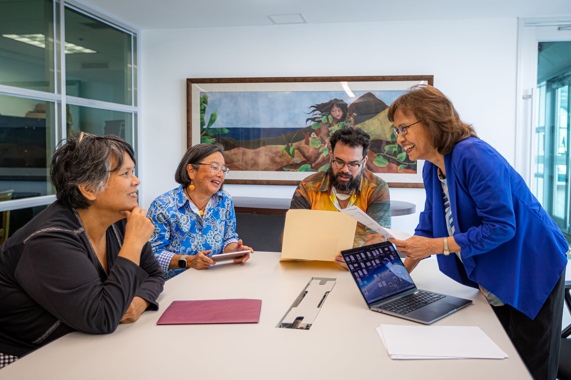 On-island members of the Na’huyong CHamoru Anthology Project board of editors discuss the project. From left, Teresita Perez, Anne Hattori, Michael Bevacqua, and Evelyn Flores.